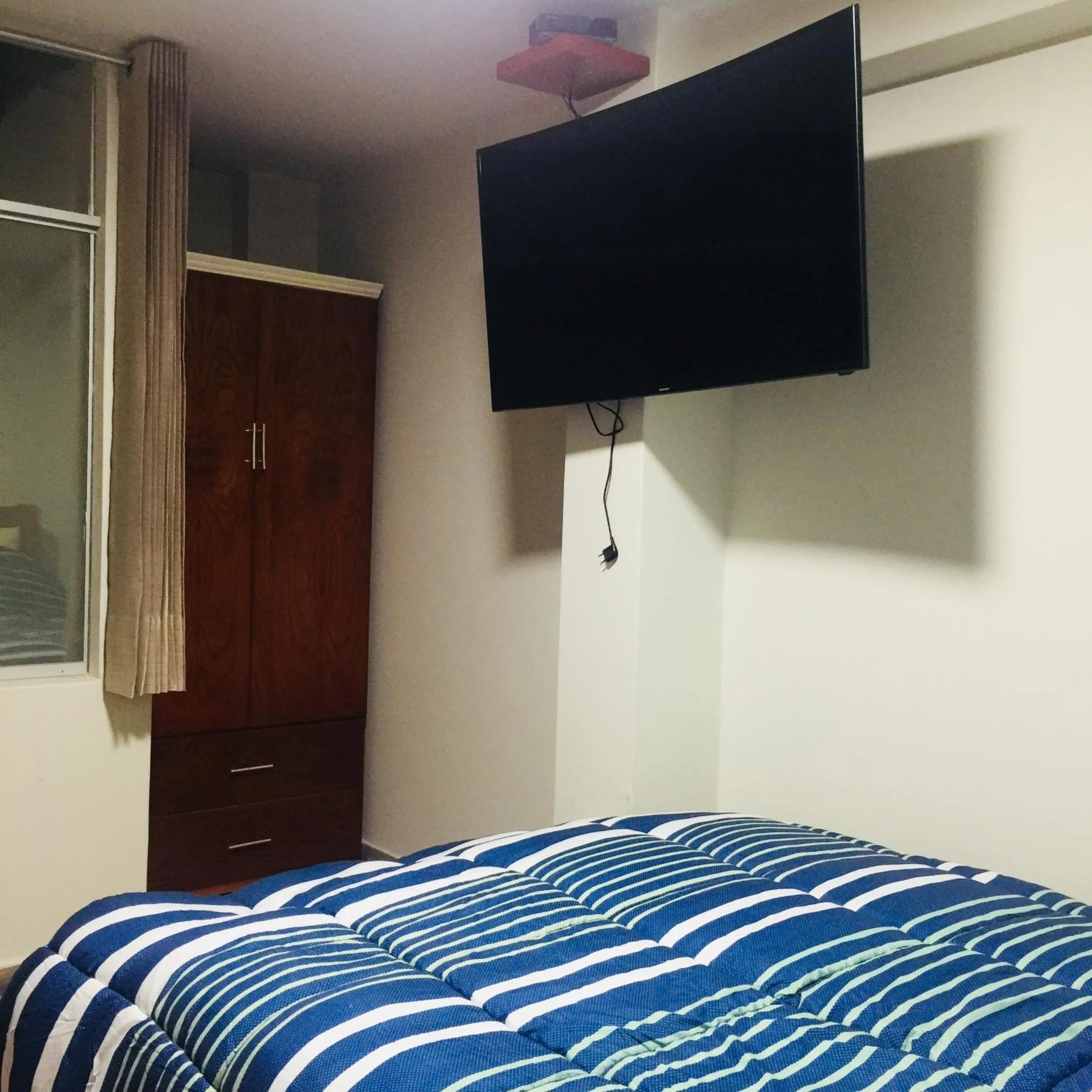 Bed in A-Hope Suite Hotel