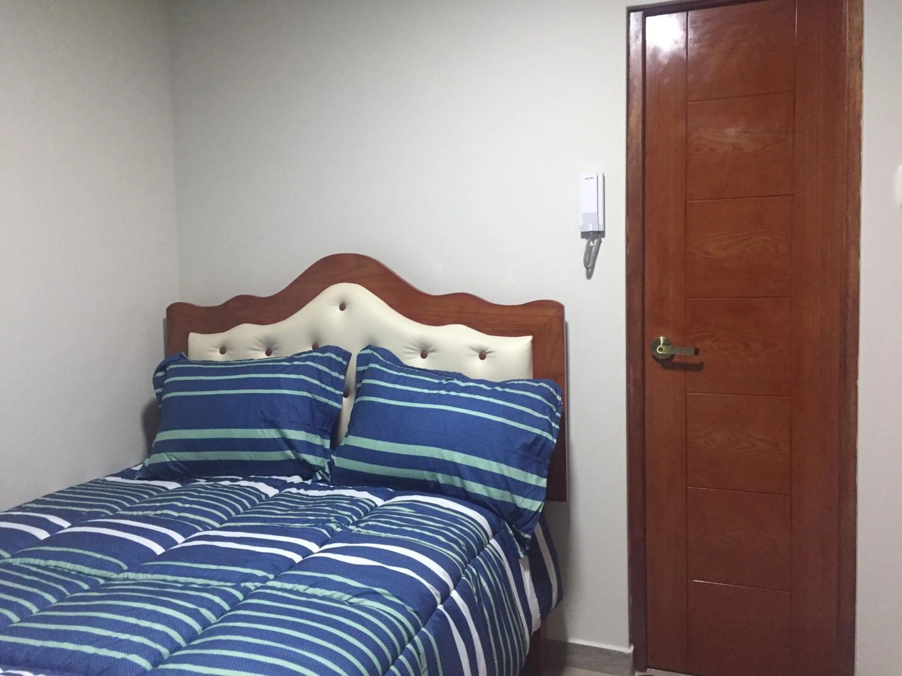 Bed in A-Hope Suite Hotel