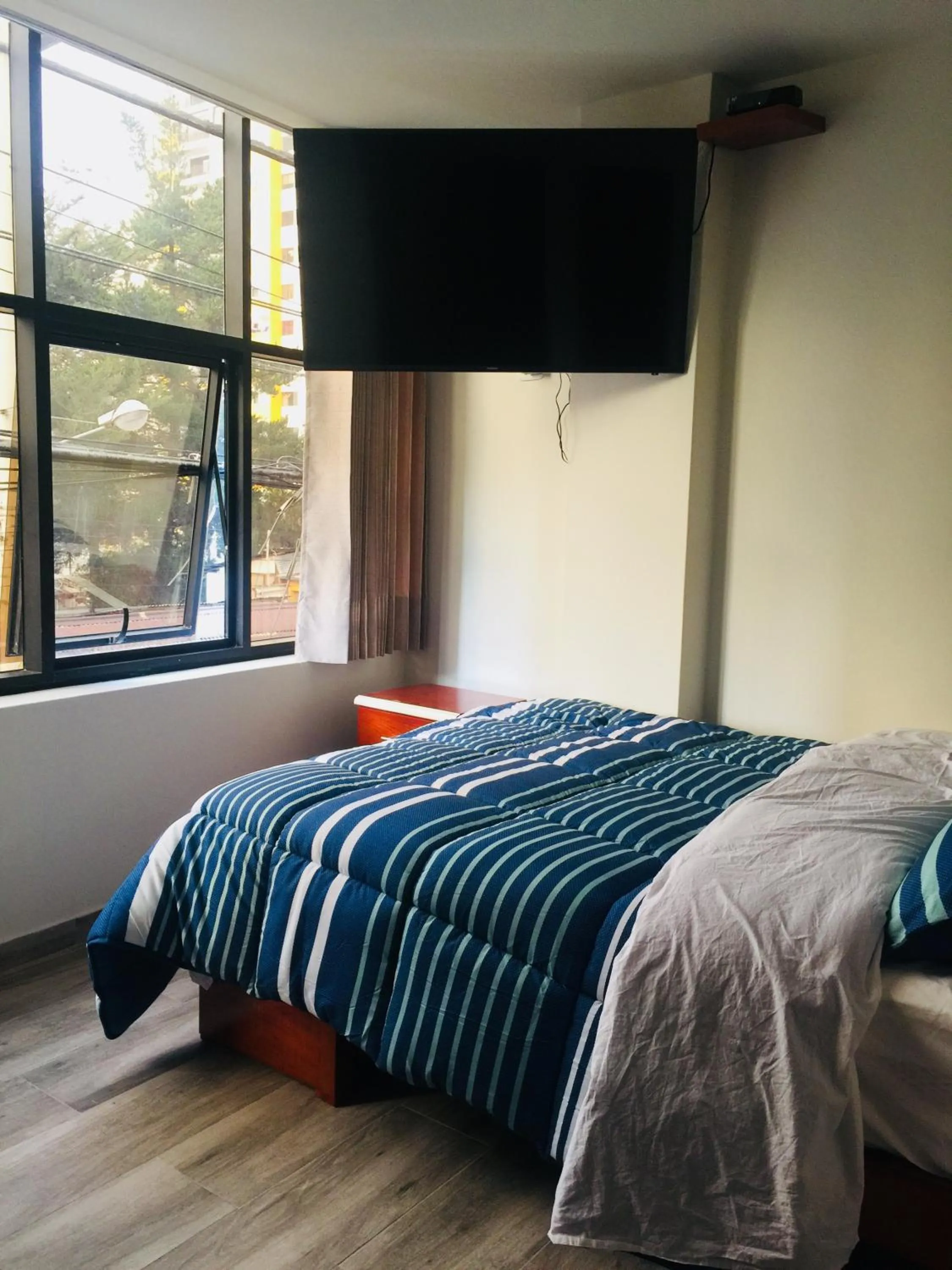 Bed in A-Hope Suite Hotel