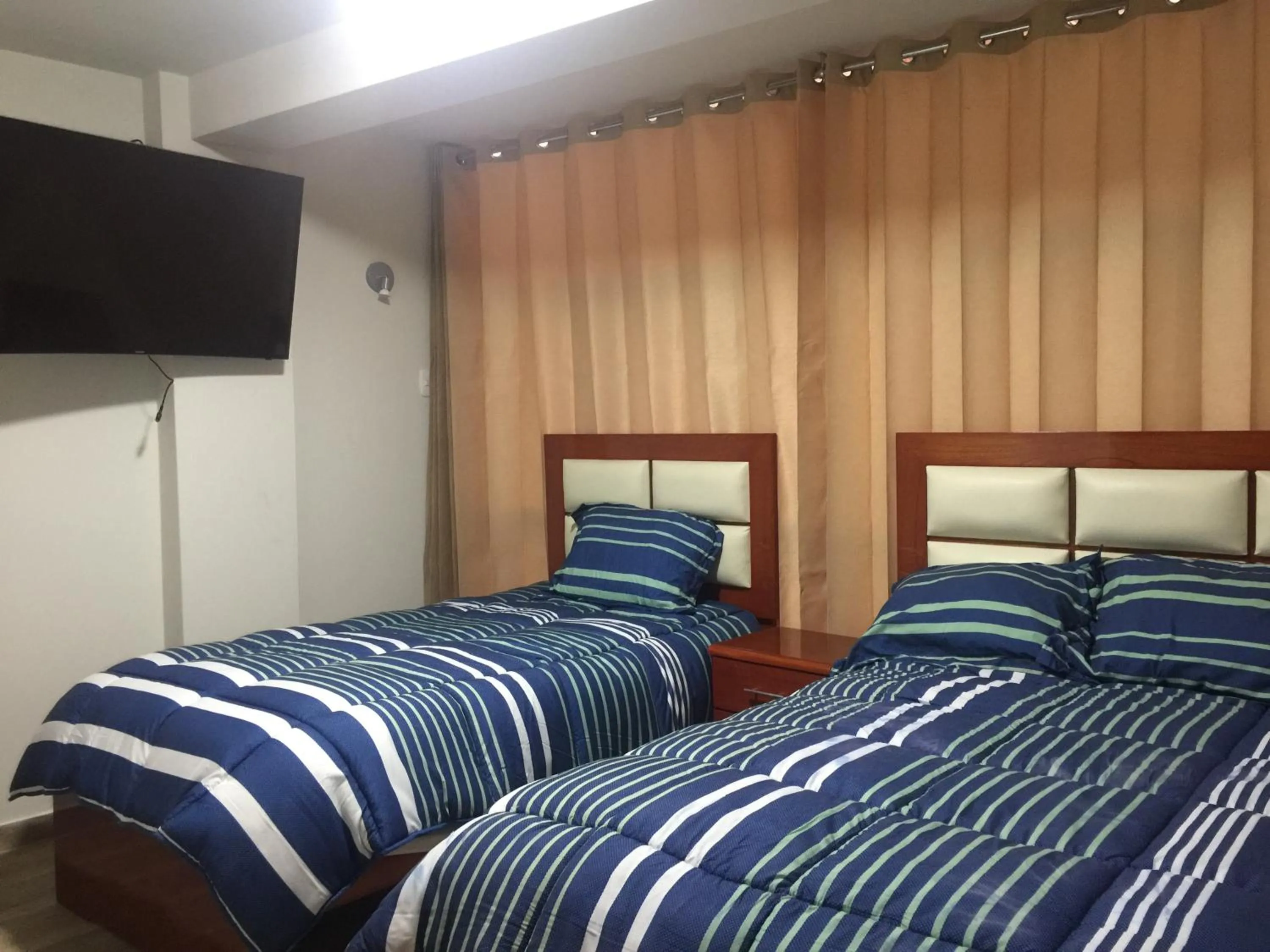 Bed in A-Hope Suite Hotel