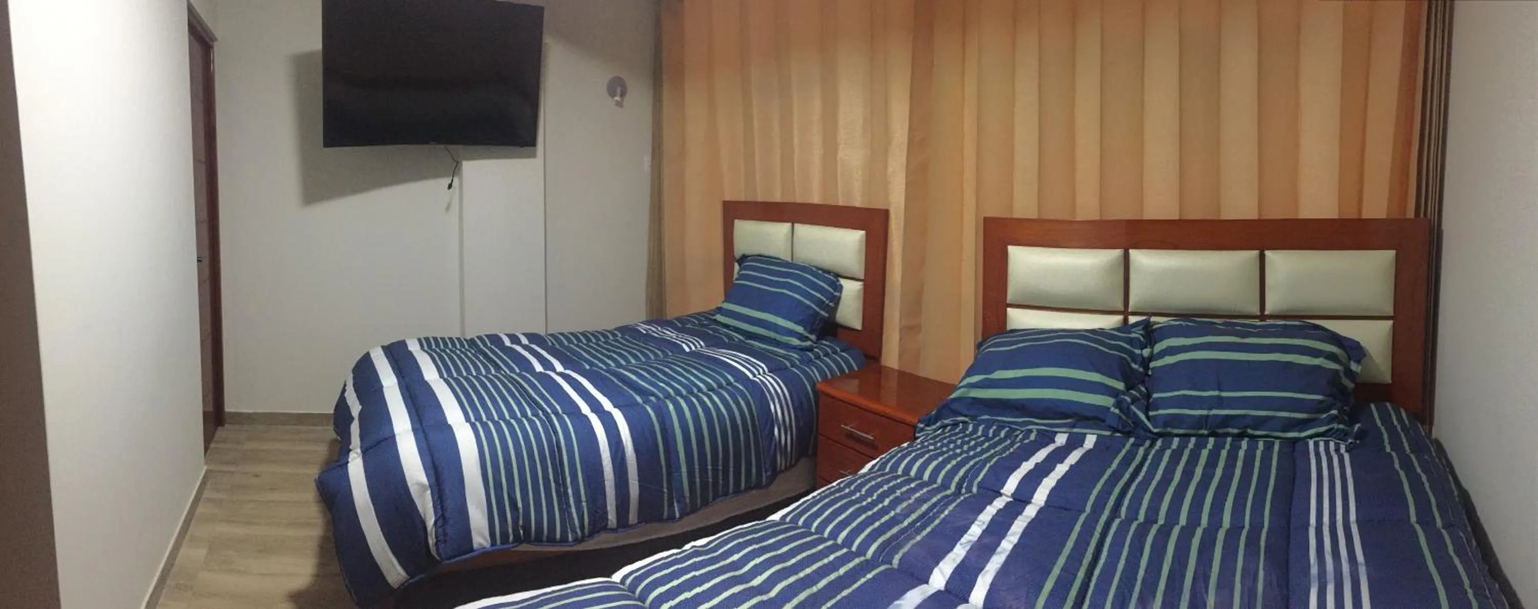 Bed in A-Hope Suite Hotel