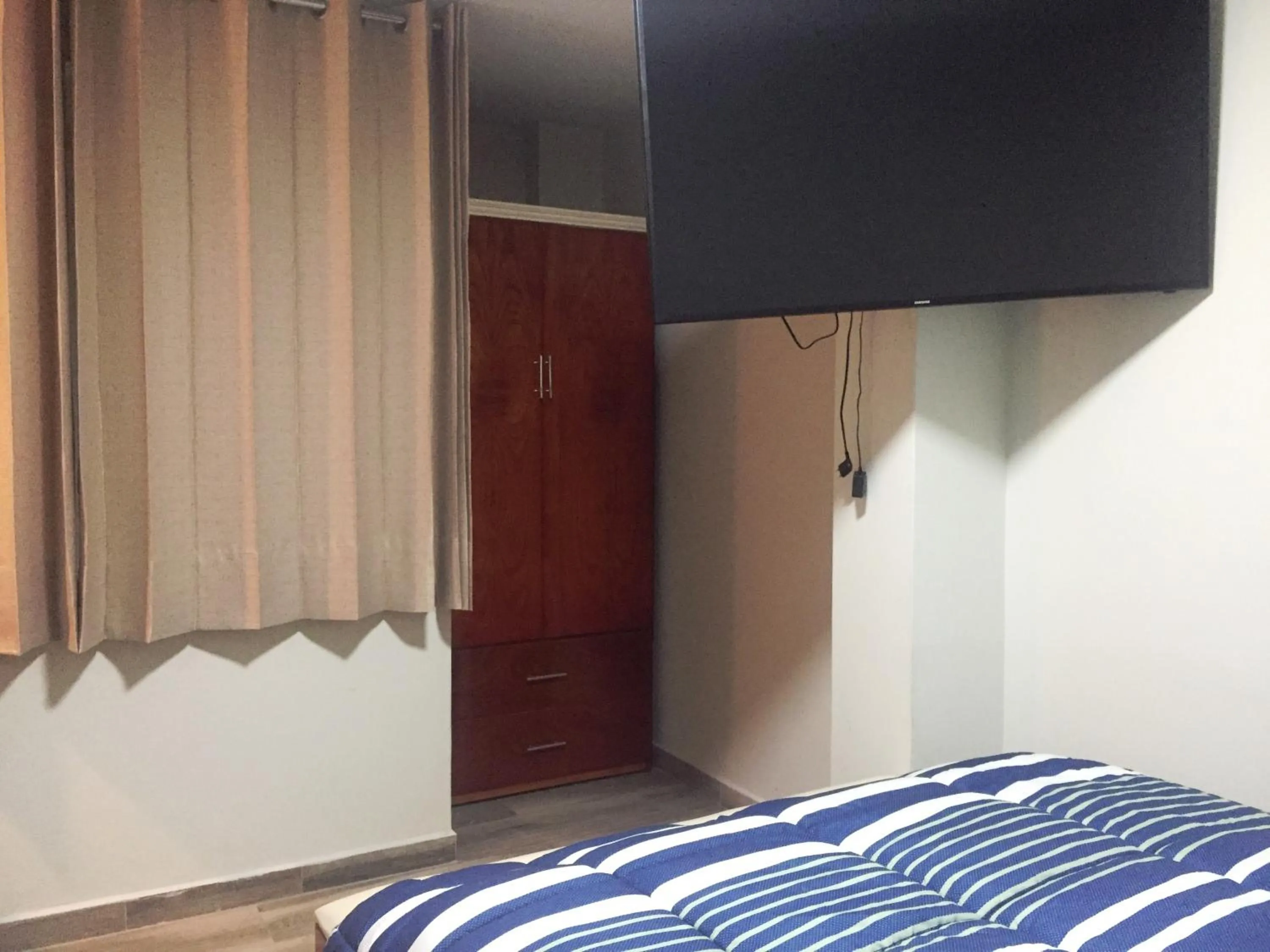 Bed in A-Hope Suite Hotel