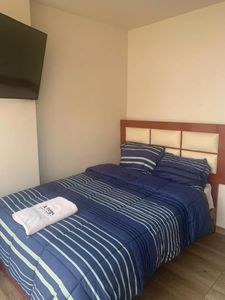 Bed in A-Hope Suite Hotel