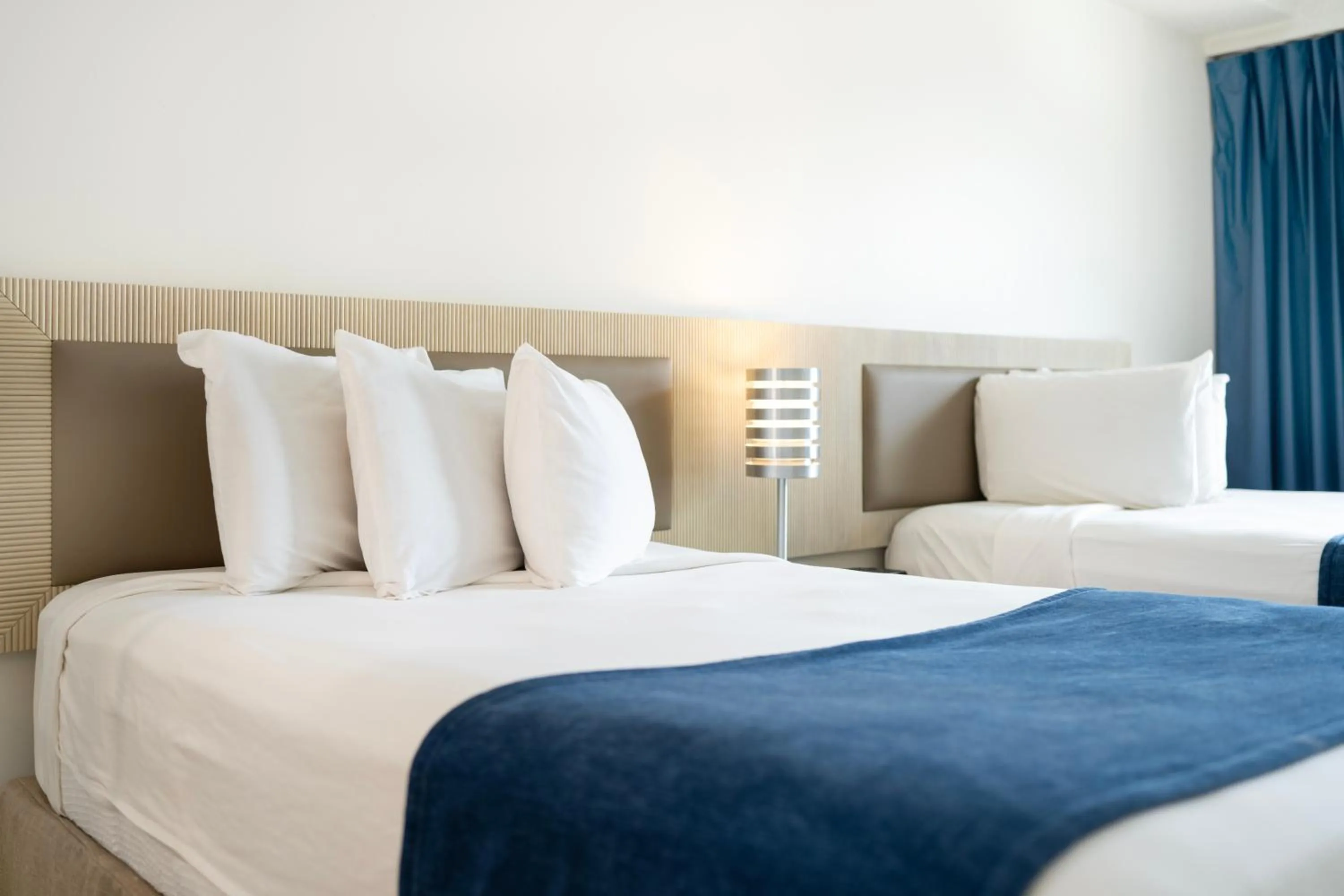 Bed in Windward Passage Hotel