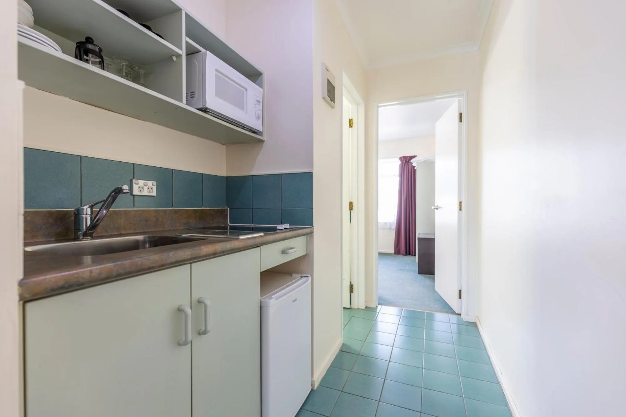 kitchen in ASURE PRINCE motor lodge