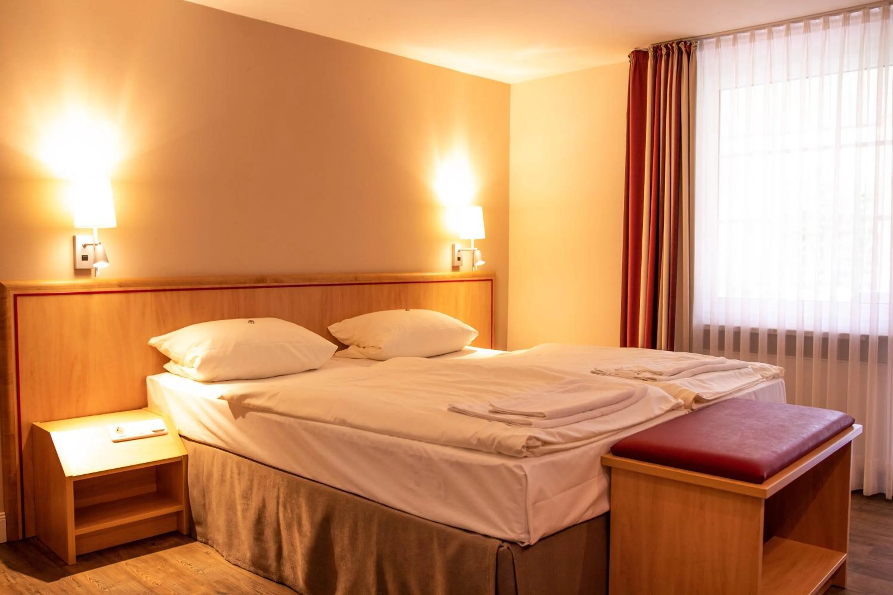 Photo of the whole room, Bed in Bundt's Hotel & Gartenrestaurant