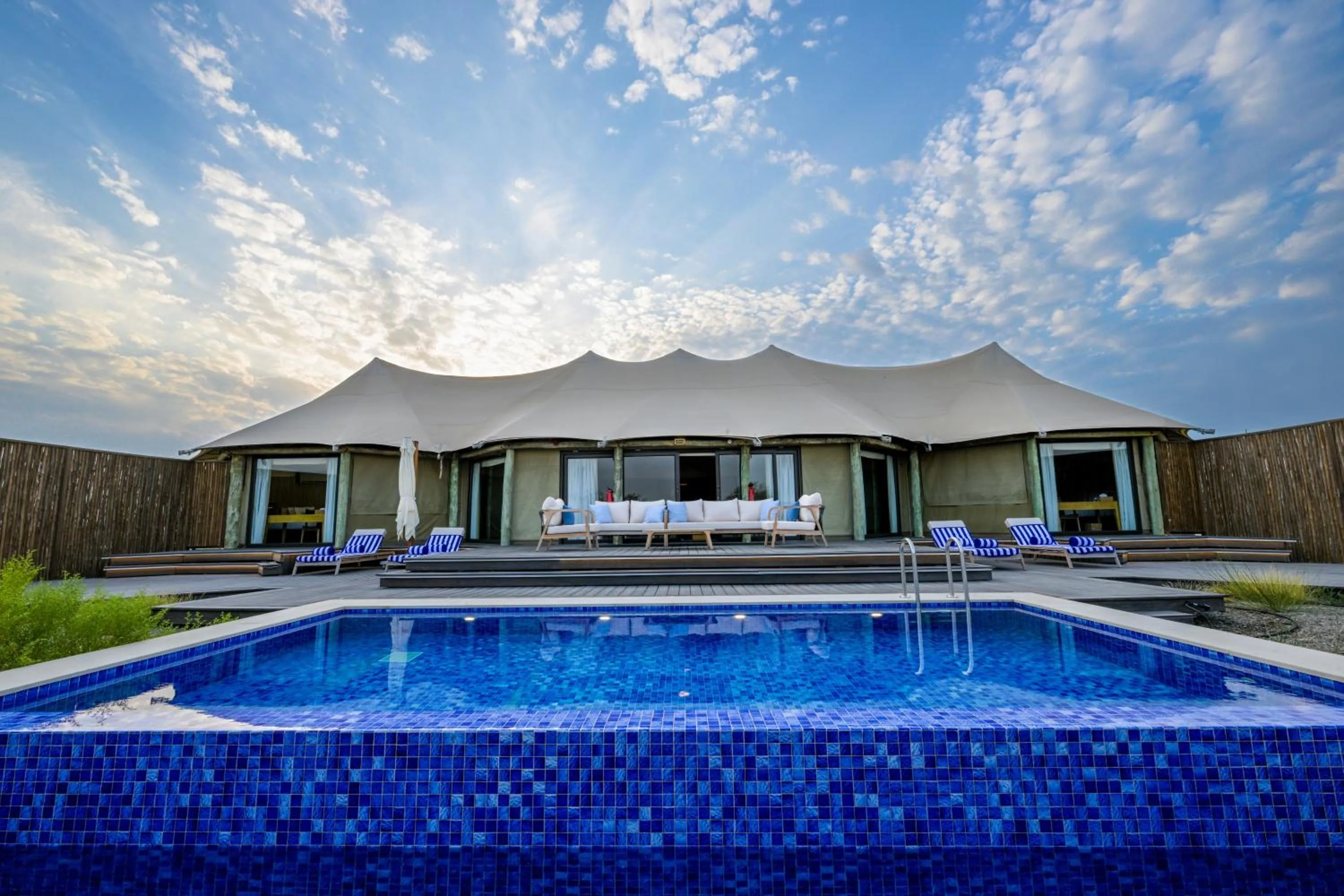 Pool view in Kingfisher Retreat by Sharjah Collection