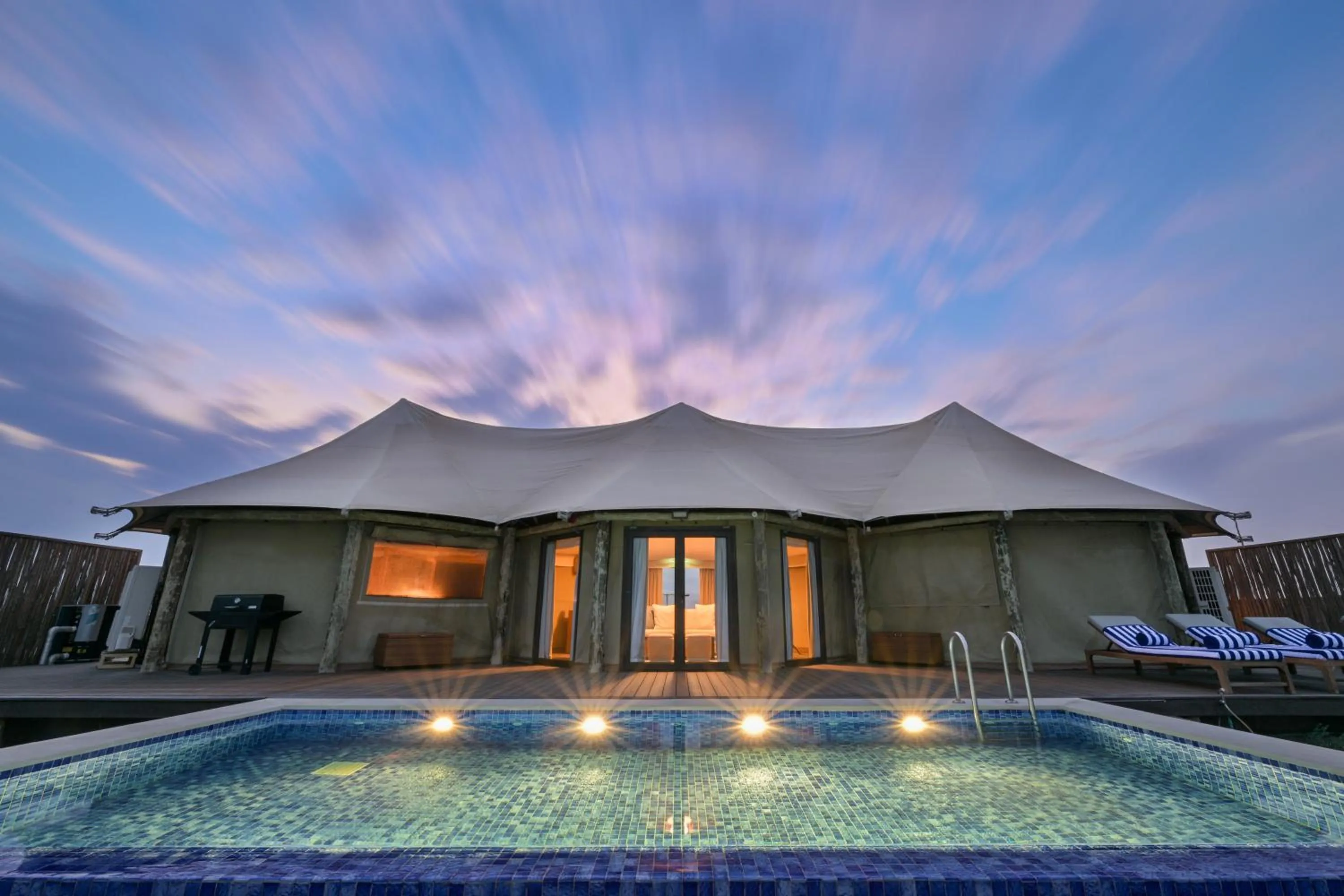 Pool view in Kingfisher Retreat by Sharjah Collection