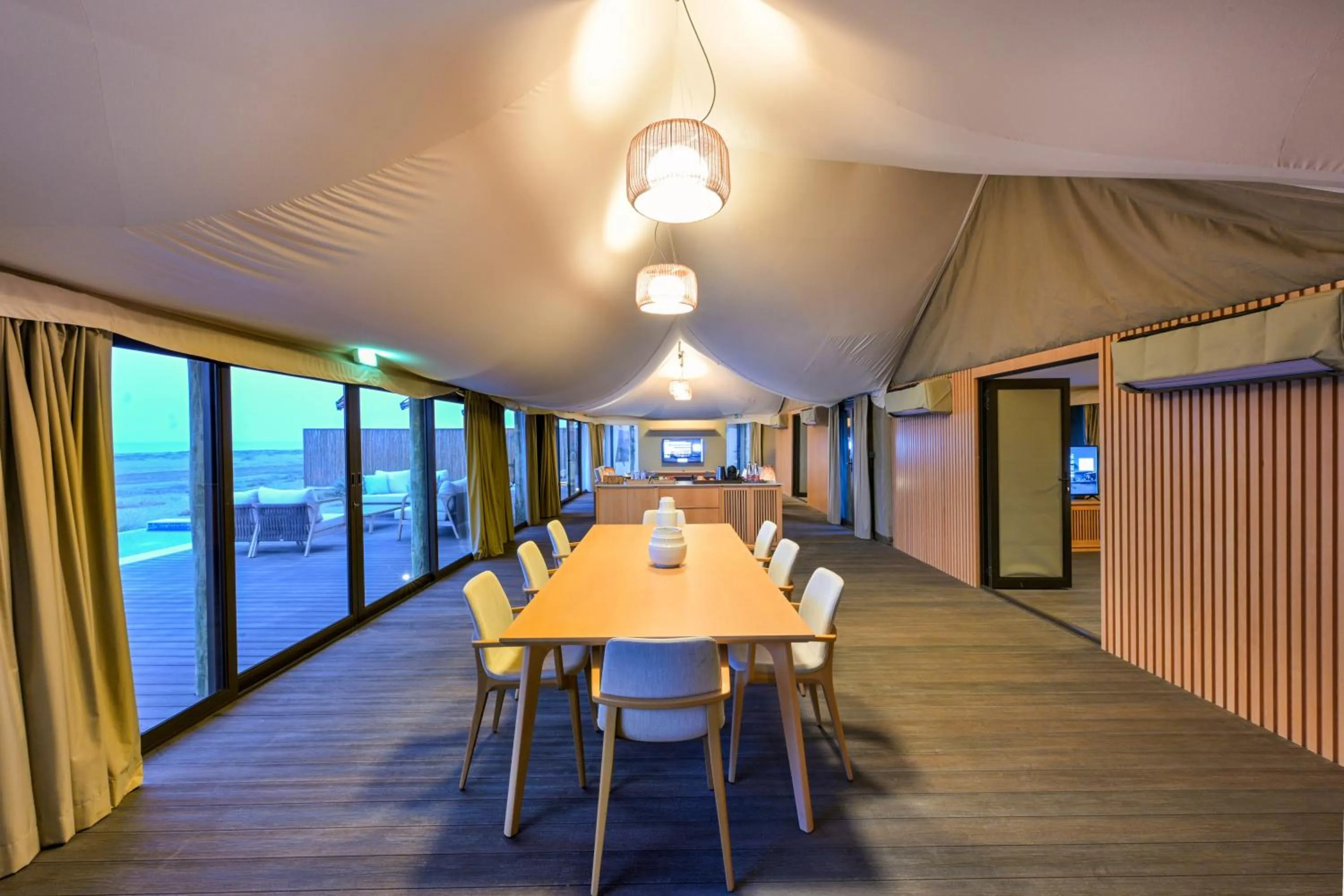 Dining area in Kingfisher Retreat by Sharjah Collection