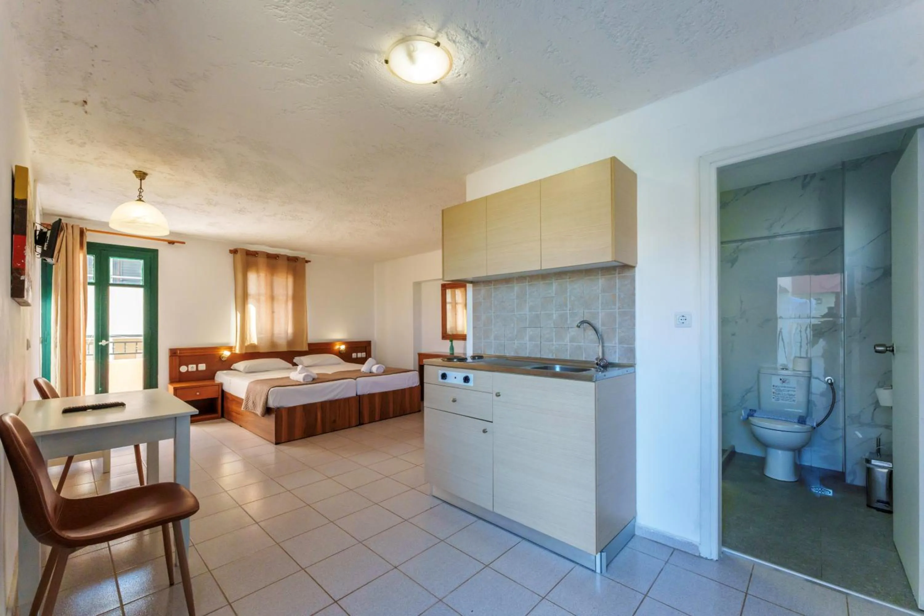 Photo of the whole room, Bed in Kri-Kri Village Holiday Apts by Estia