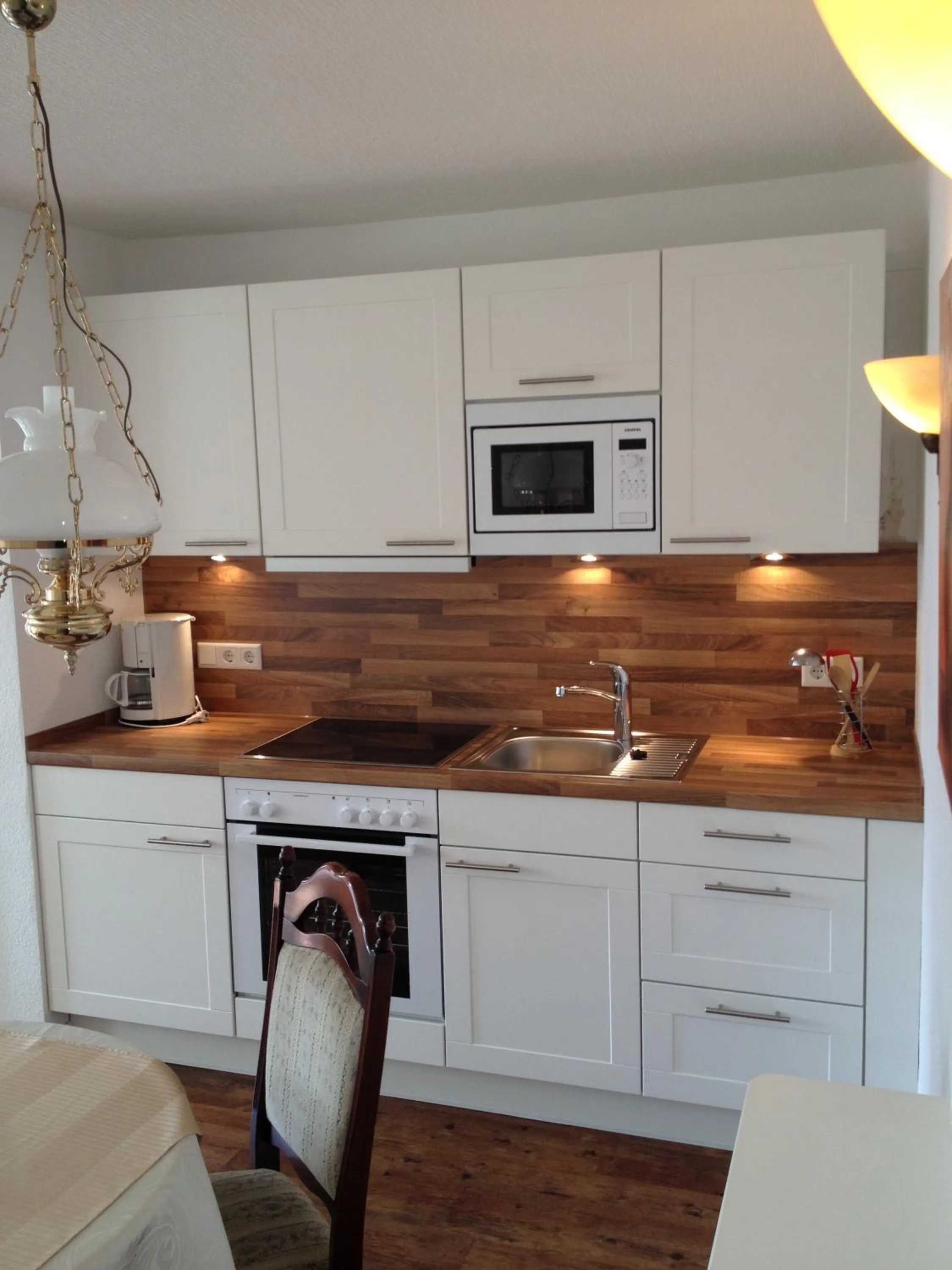 Kitchen or kitchenette in Inselhotel Arfsten