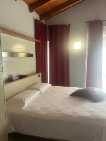 Bed in Albavillage Rooms & Camping