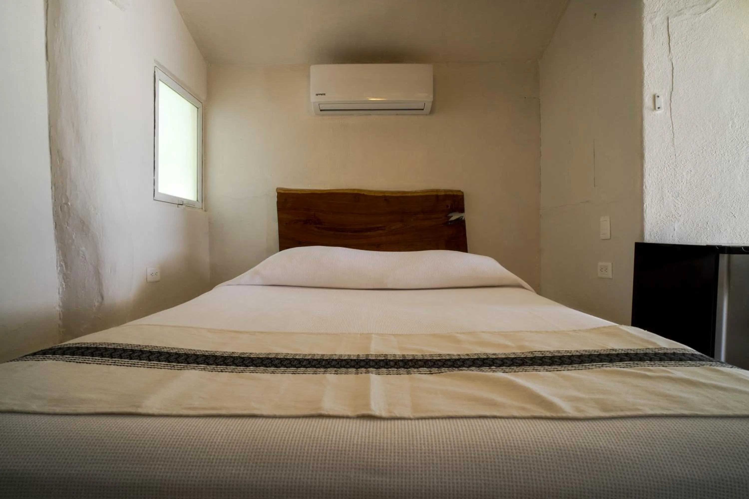 Bed in BT Live Tulum located at the party zone