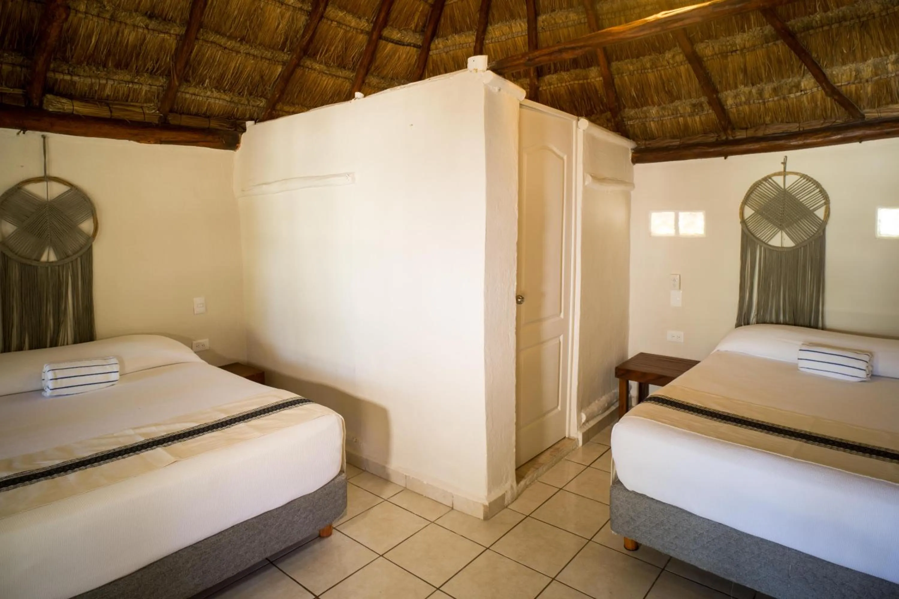 Bed in BT Live Tulum located at the party zone