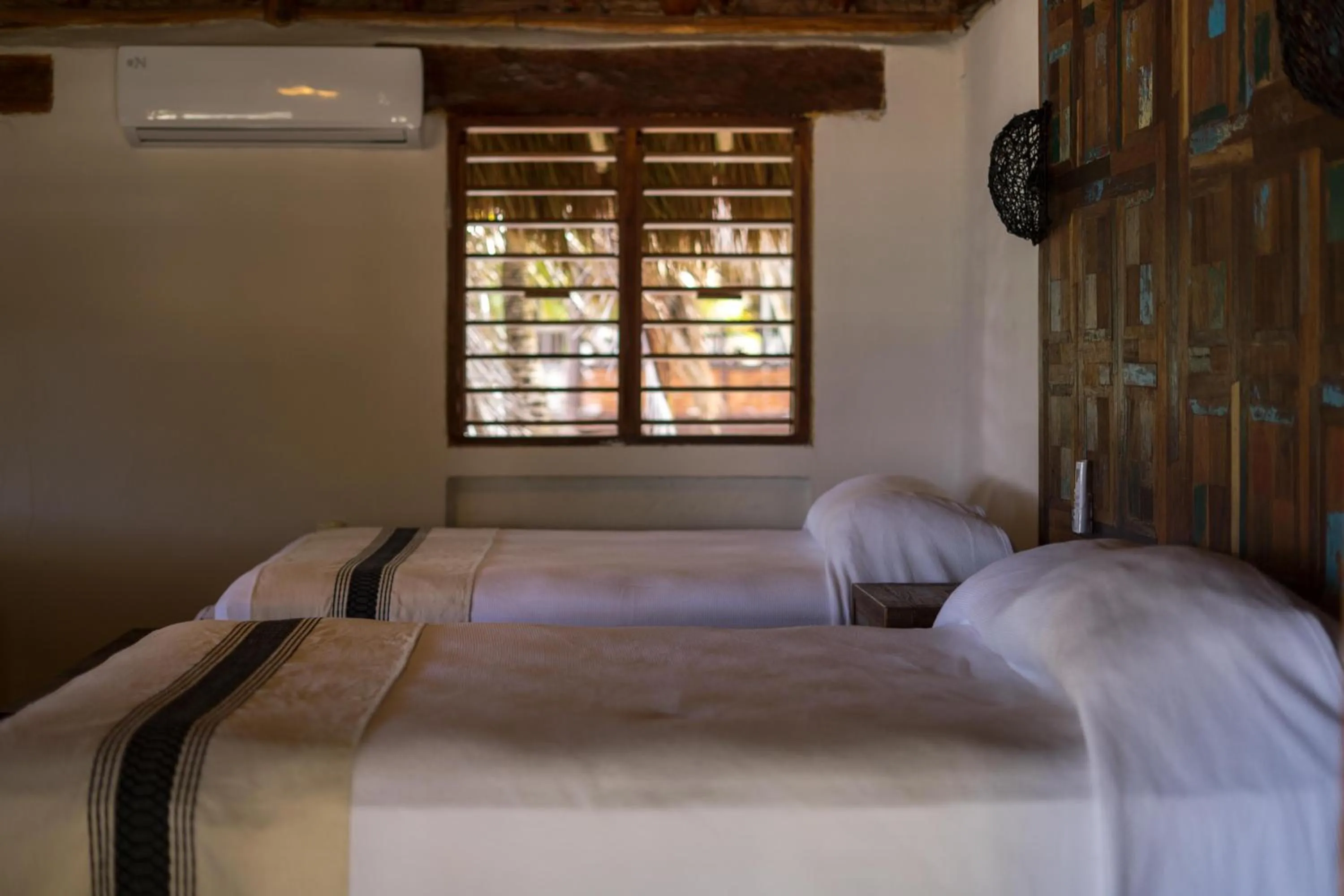 Bed in BT Live Tulum located at the party zone