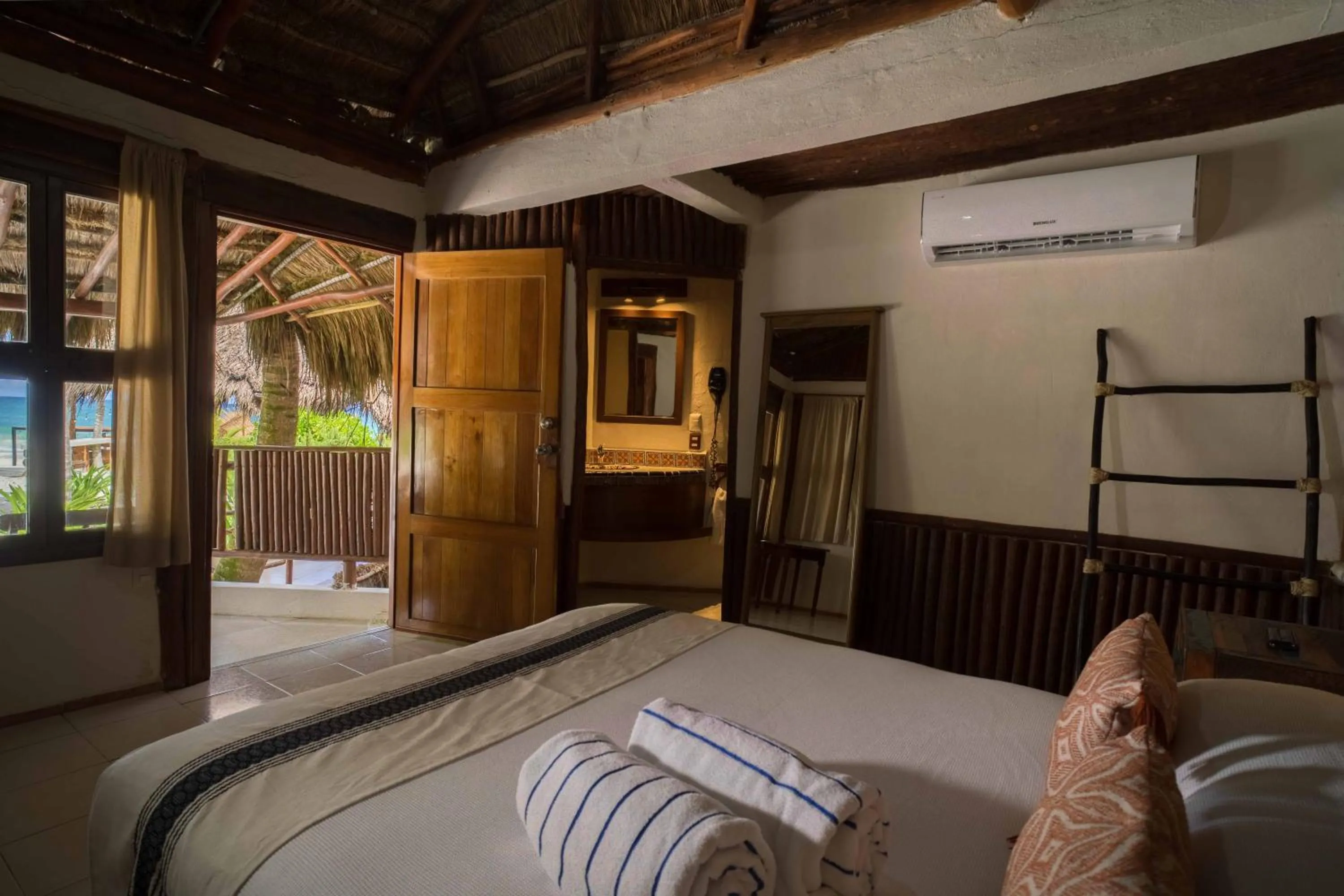 Bed in BT Live Tulum located at the party zone