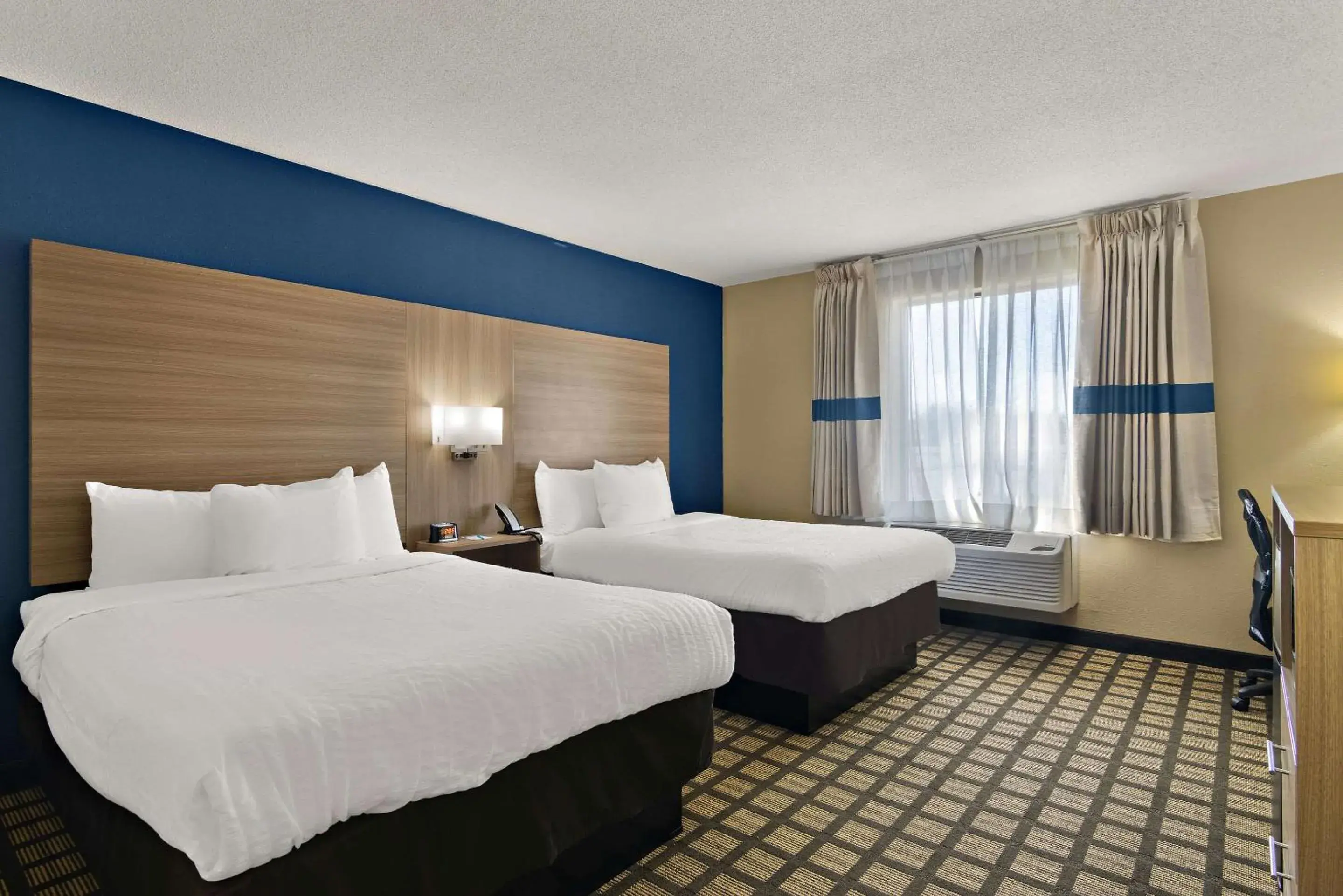 Bedroom, Bed in Clarion Pointe Bloomington-Normal near I-55 and University Bedroom, Bed in Clarion Pointe Bloomington-Normal near I-55 and University