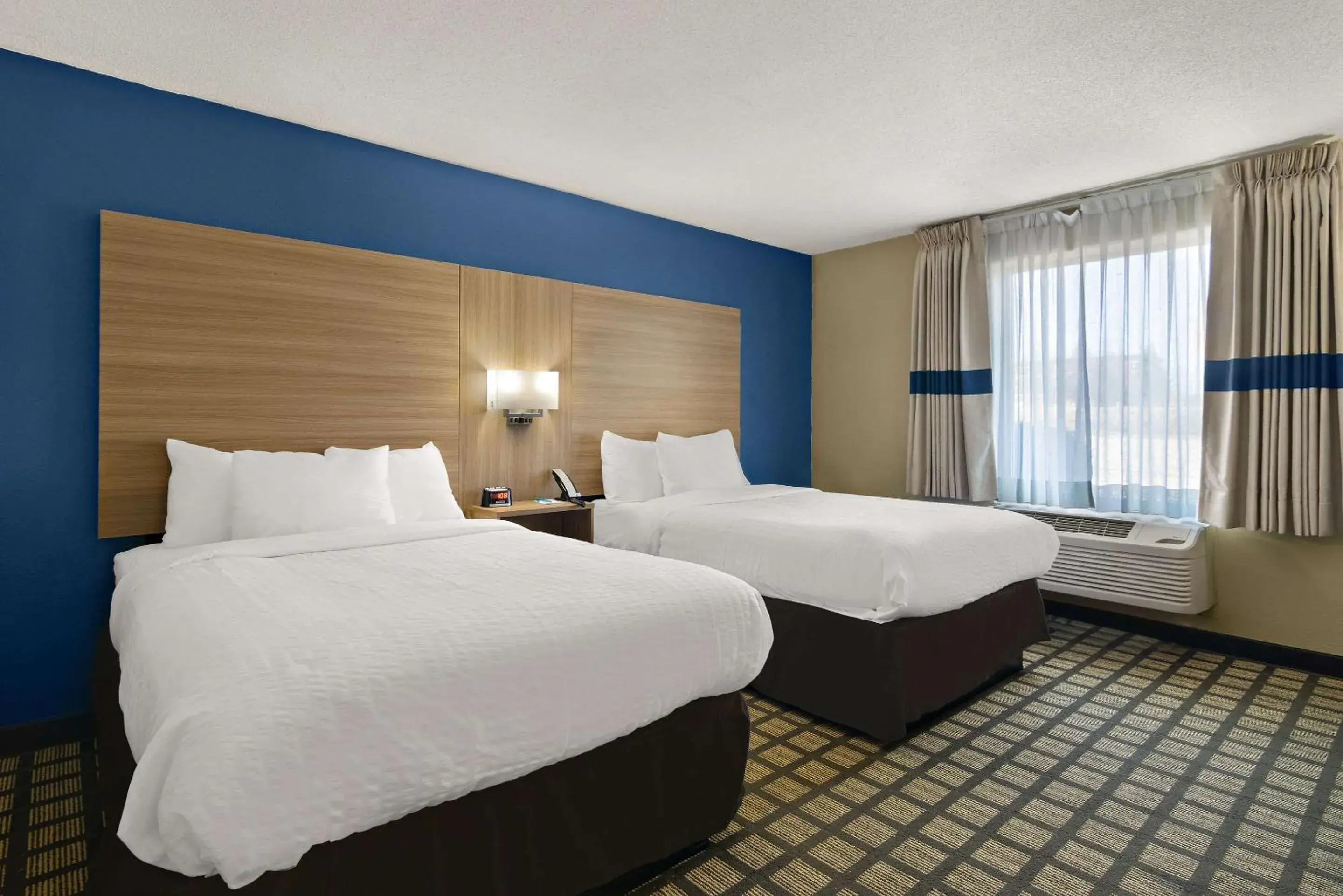 Bedroom, Bed in Clarion Pointe Bloomington-Normal near I-55 and University Bedroom, Bed in Clarion Pointe Bloomington-Normal near I-55 and University