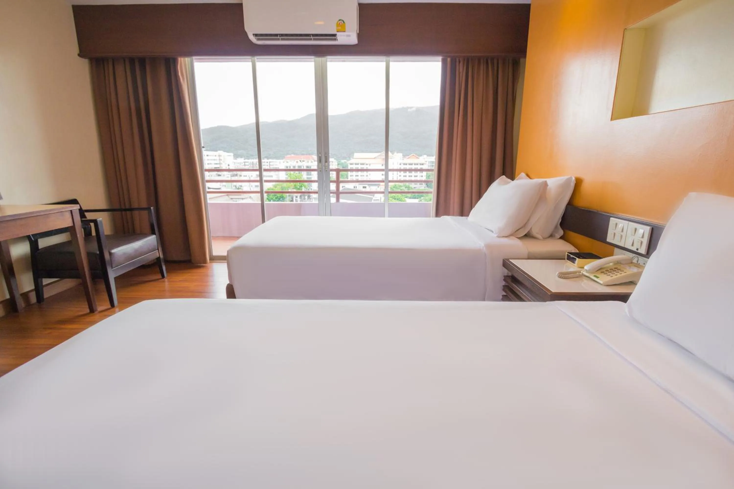 Bed in Mayflower Grande Chiang Mai