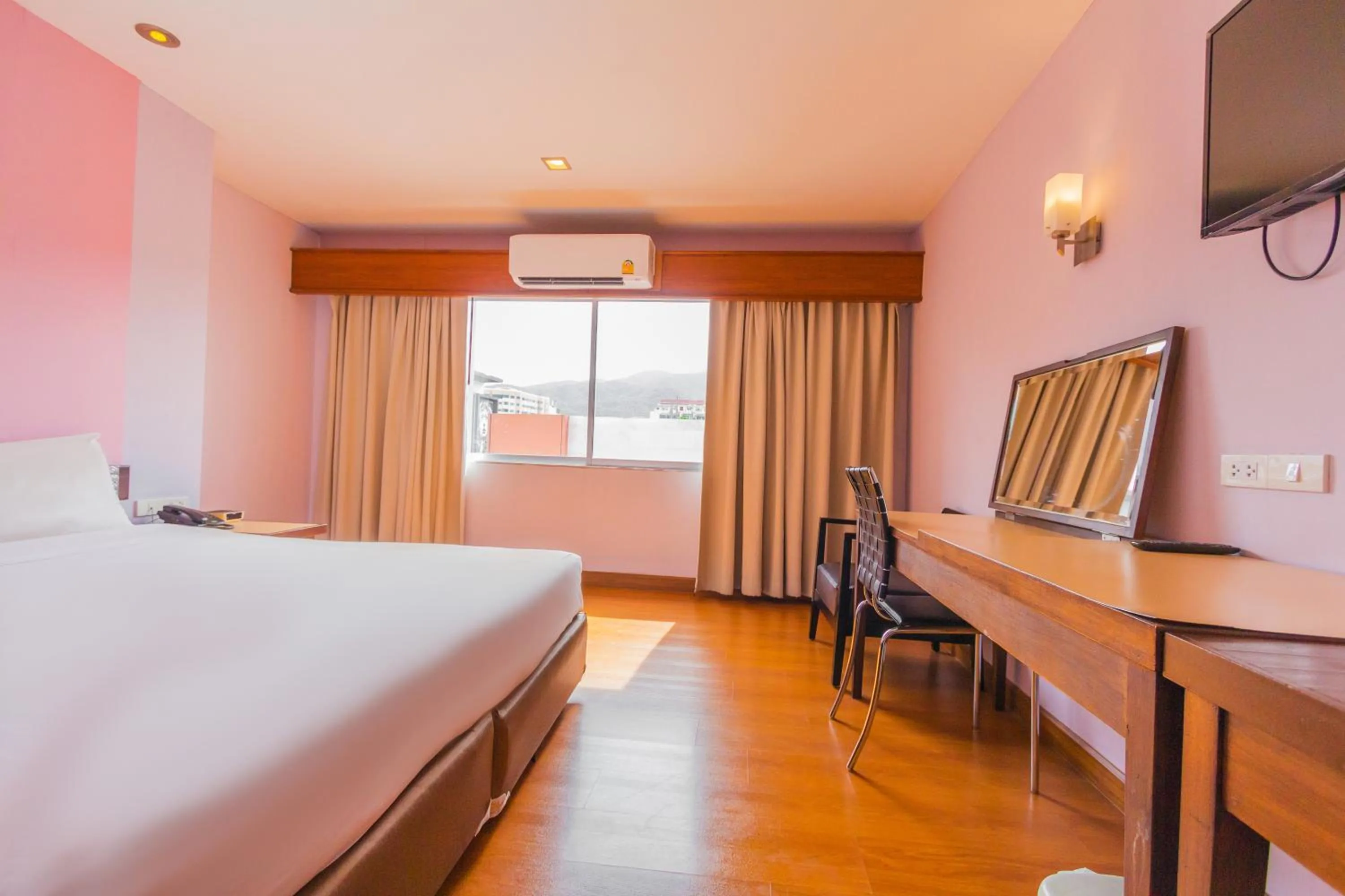 Bed in Mayflower Grande Chiang Mai