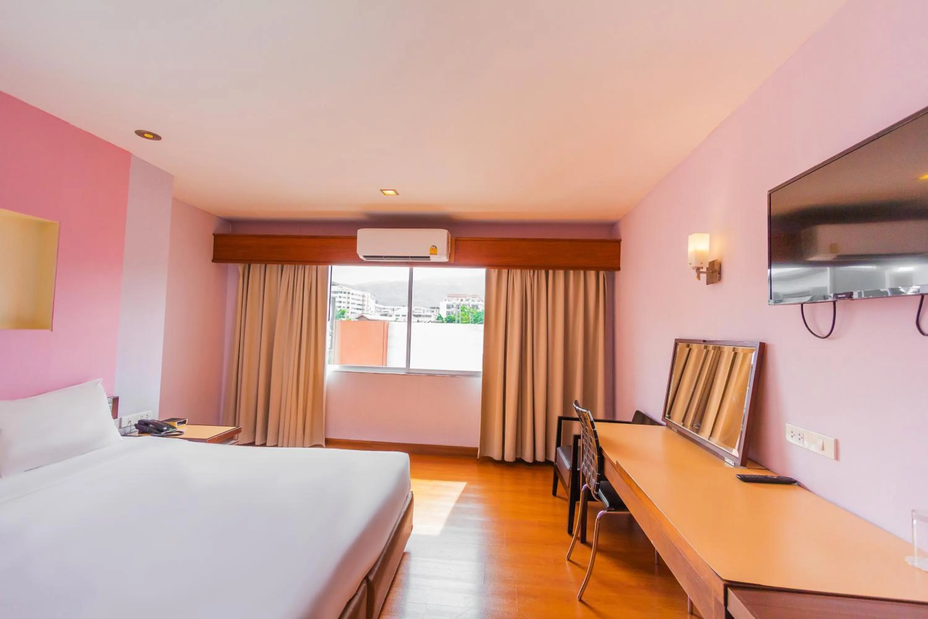 Bed in Mayflower Grande Chiang Mai