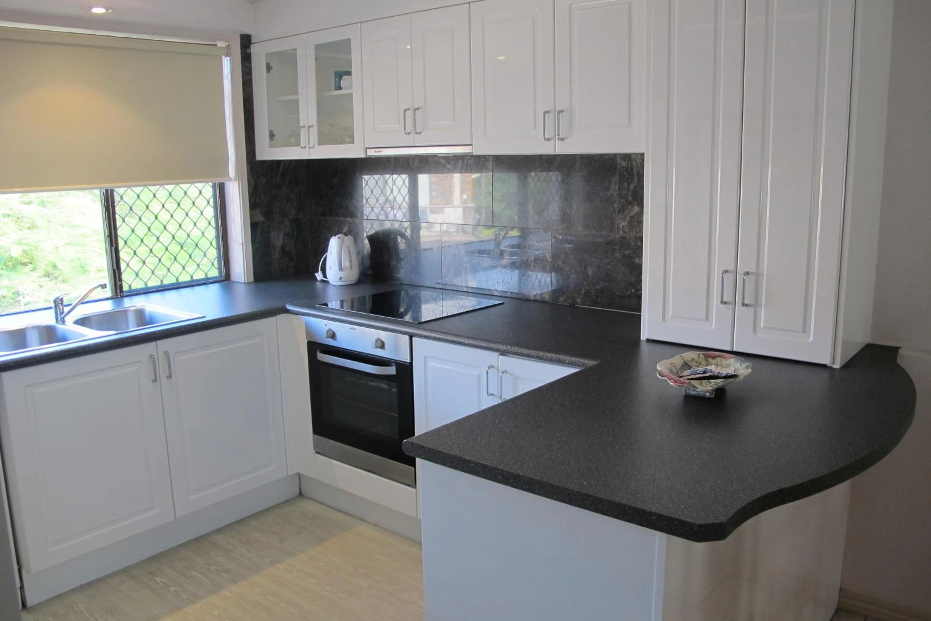 Kitchen or kitchenette in Grangewood Court Apartments
