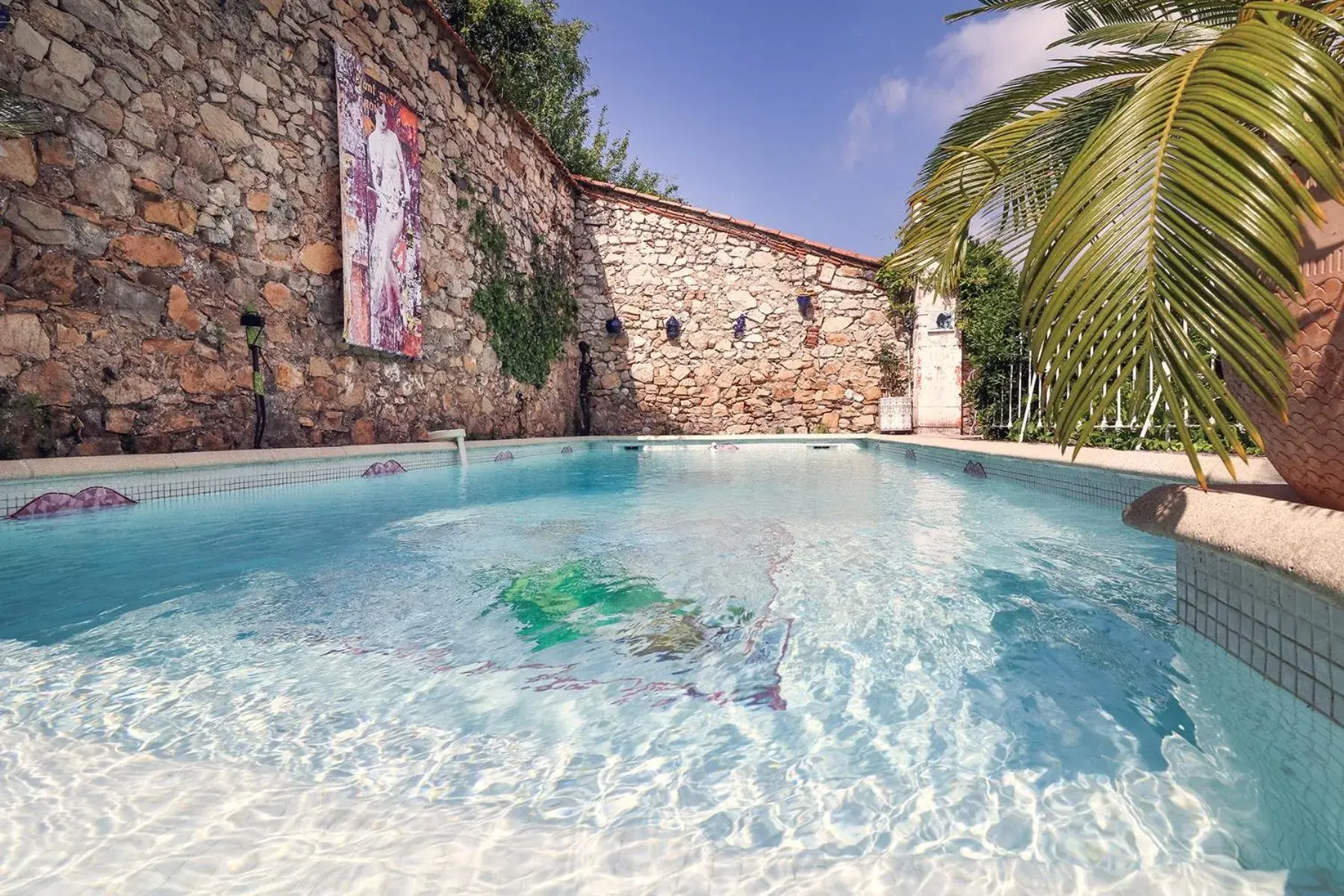 Swimming pool in La Roseraie Swimming pool in La Roseraie