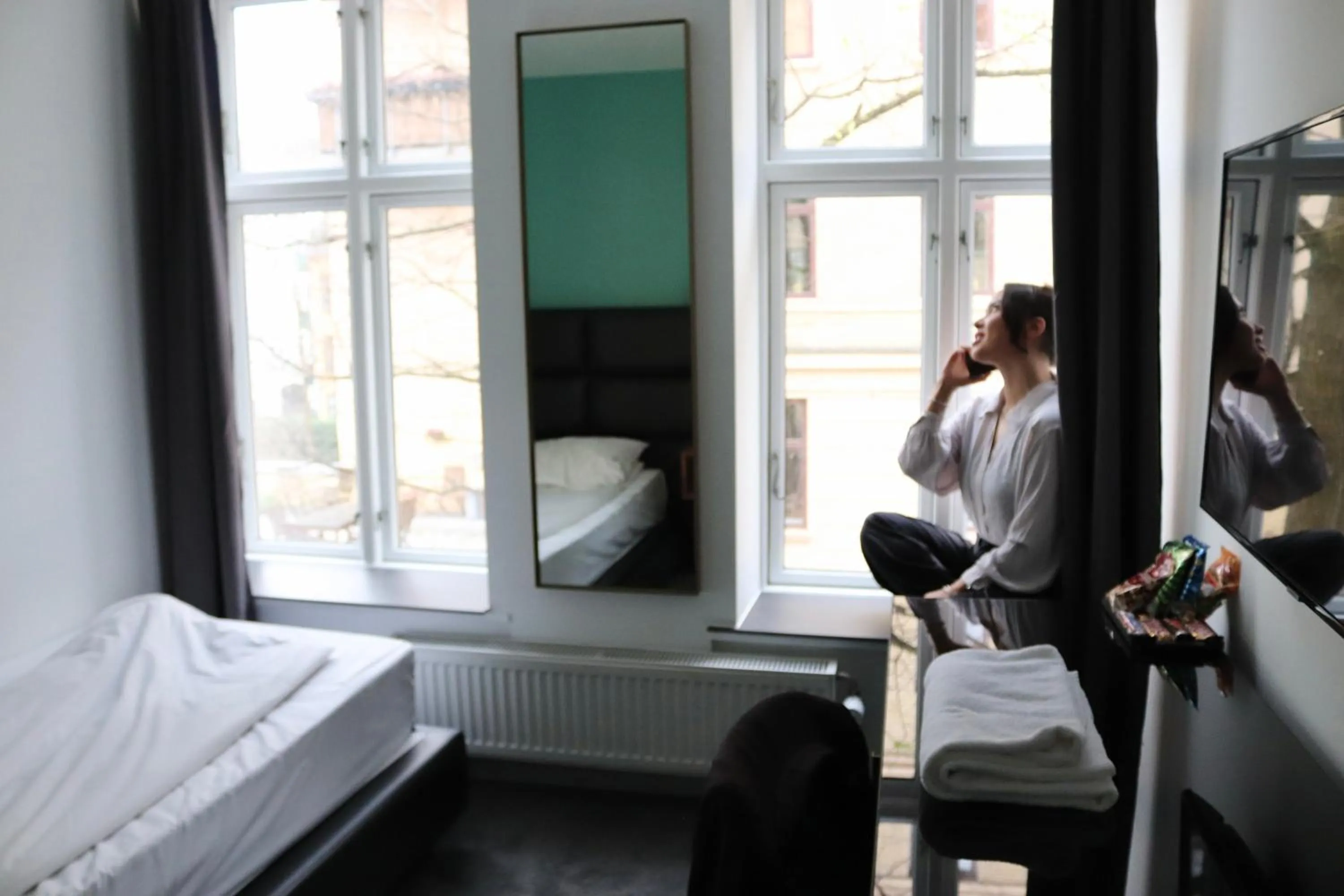 Seating area, Bed in A Hotels City