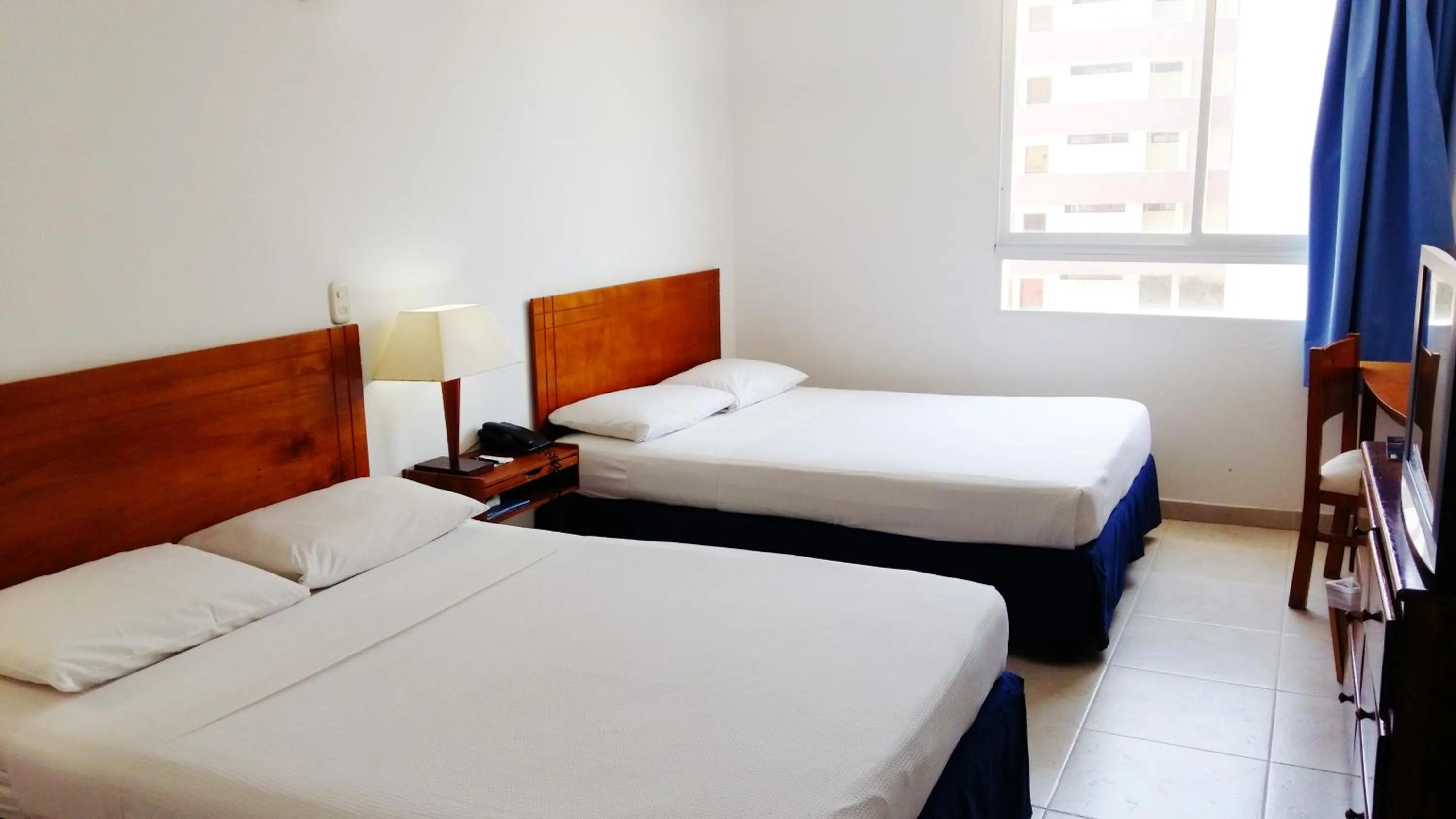 Bed in Blu Hotel by Tamaca