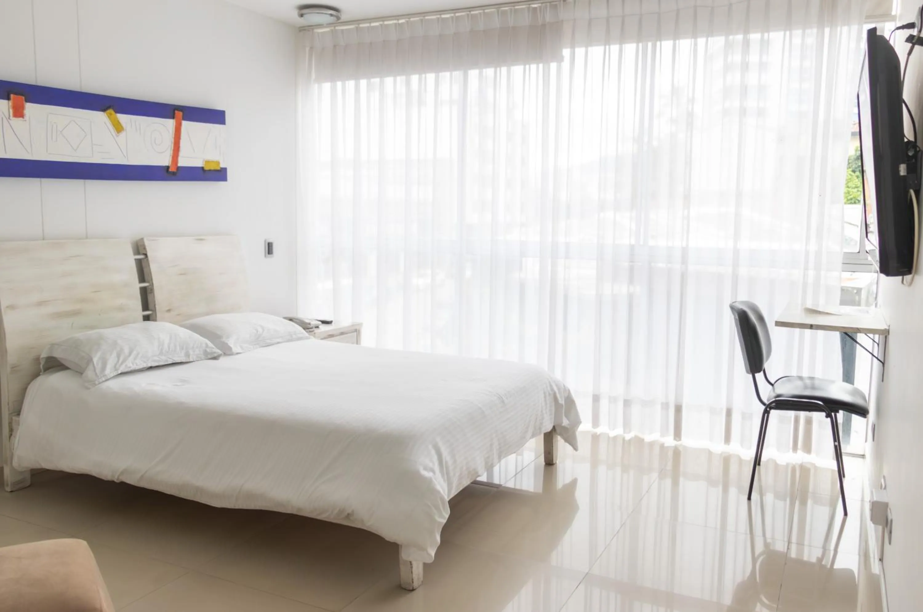 Bed in Monterosa Apartamentos Amoblados