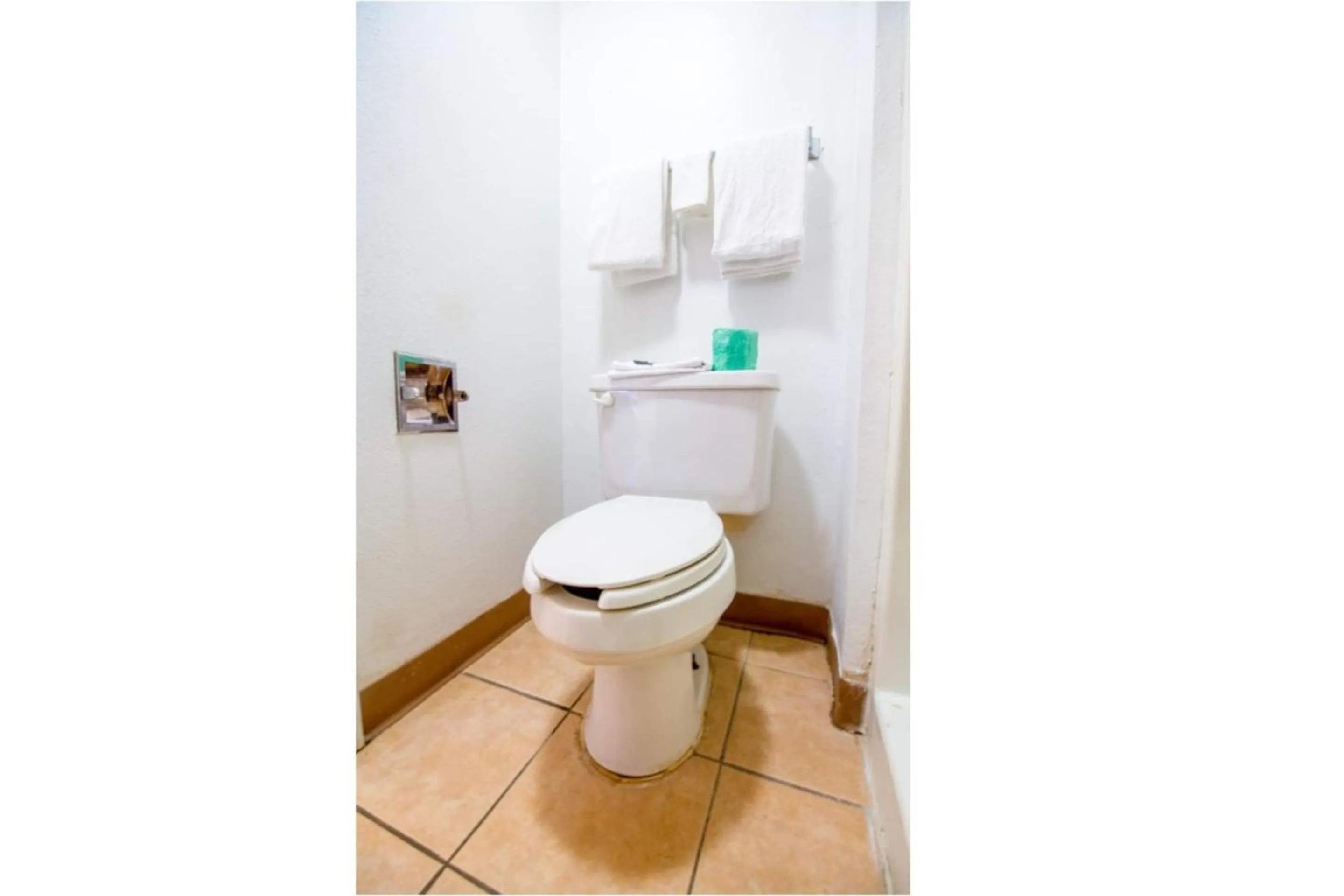 Bathroom in Studio Inn Extended Stay Oklahoma City Airport by OYO