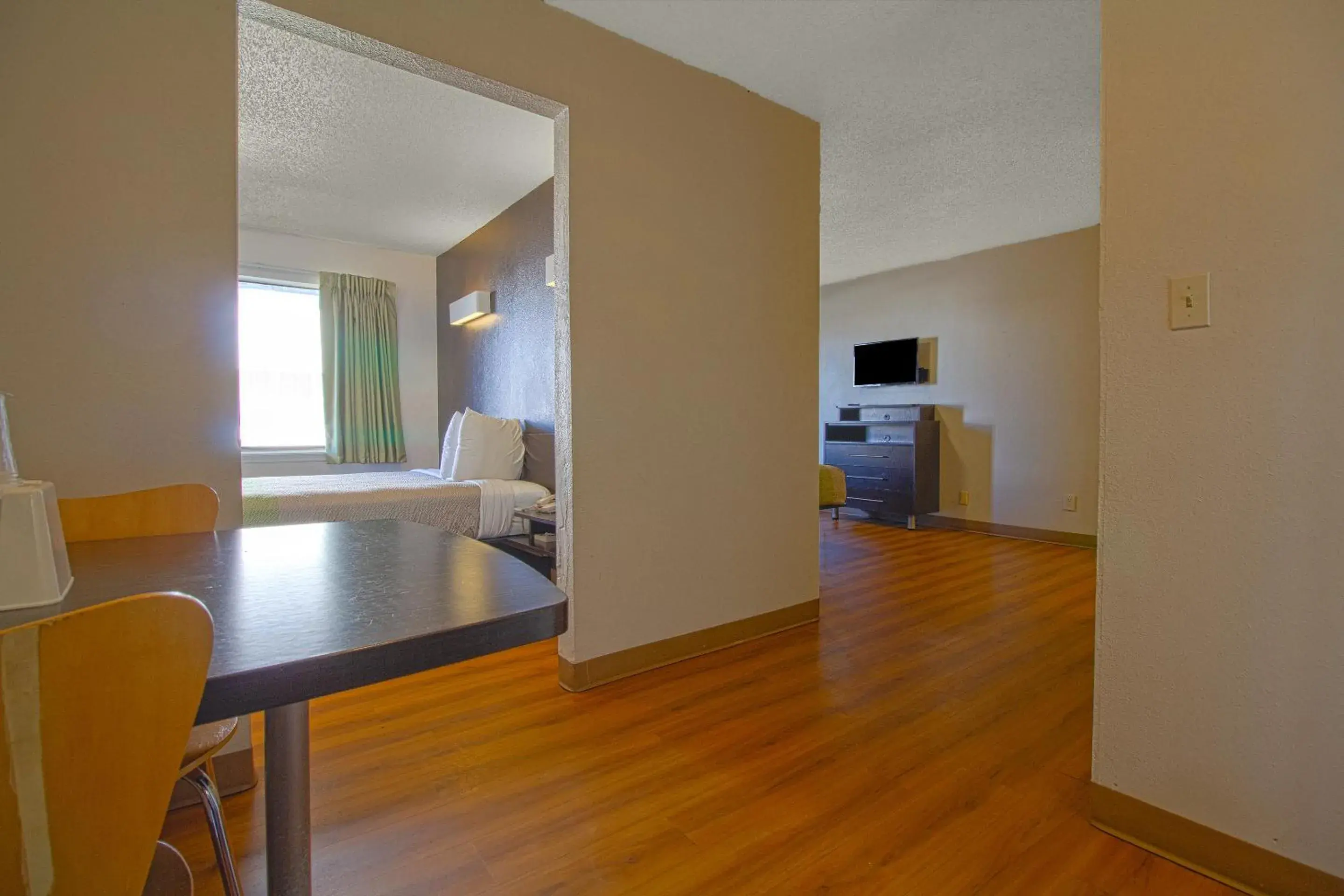 Bedroom, TV/Entertainment Center in Studio Inn Extended Stay Oklahoma City Airport by OYO