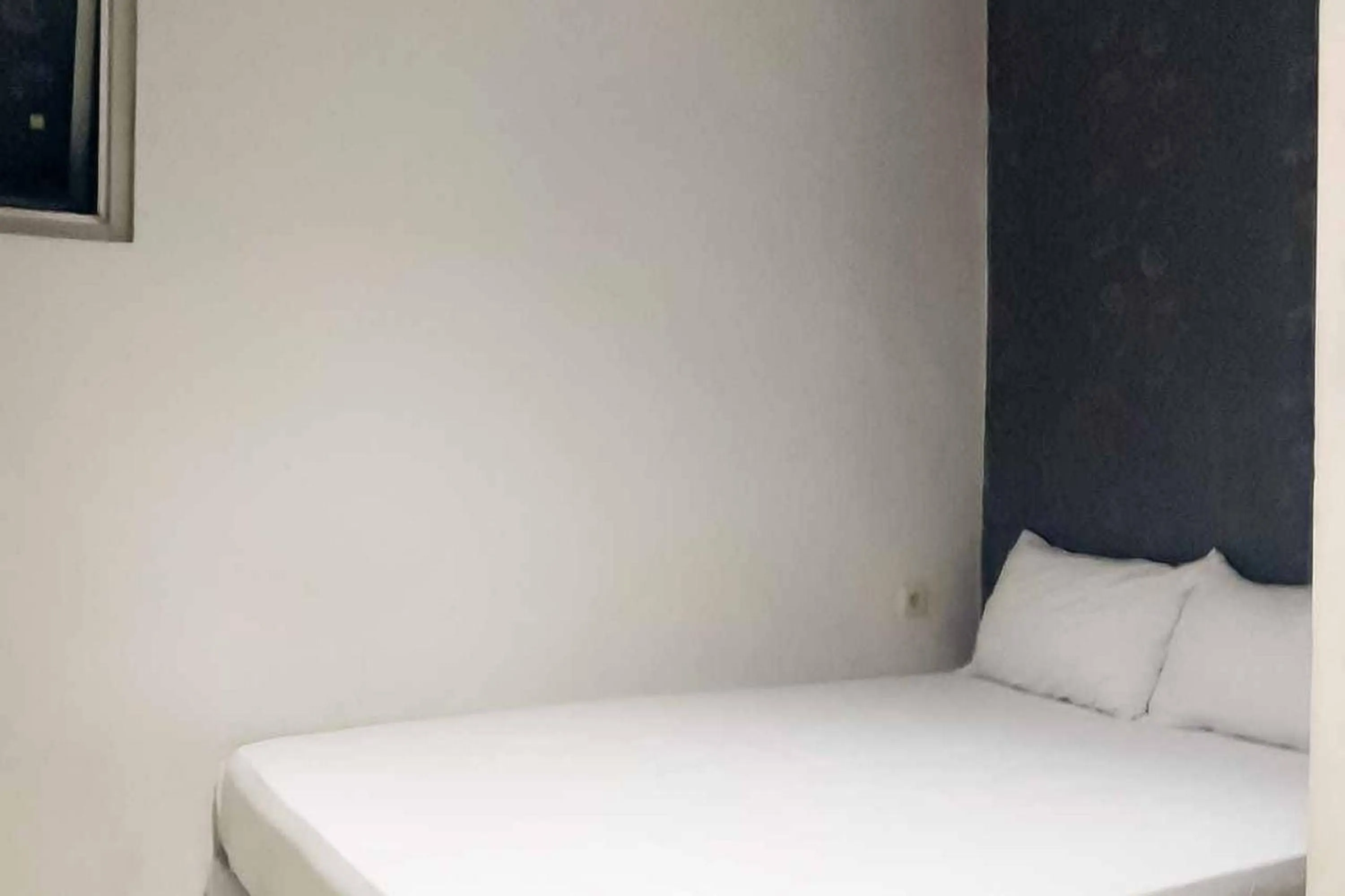 Bed in Rumahku Hayam Wuruk Mitra RedDoorz