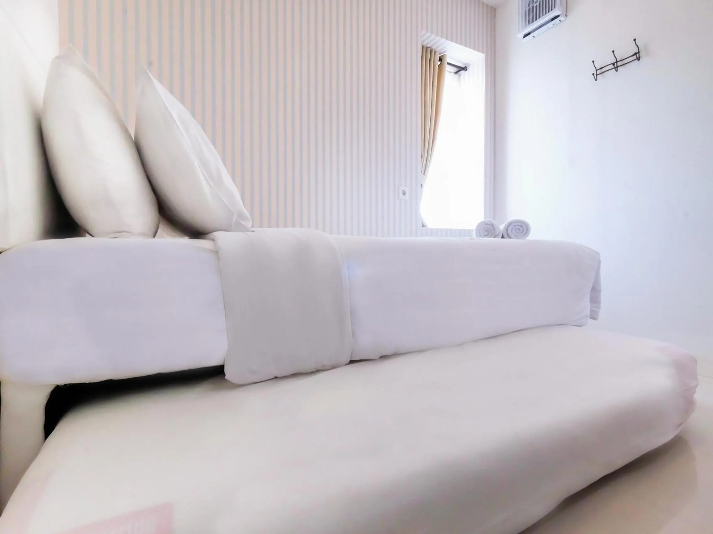 2 BR Bassura City Apartment with Mall Access By Travelio