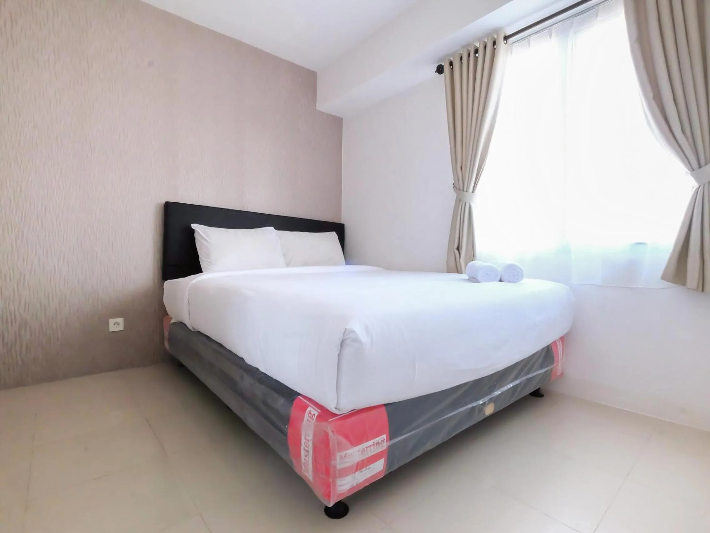 2 BR Bassura City Apartment with Mall Access By Travelio