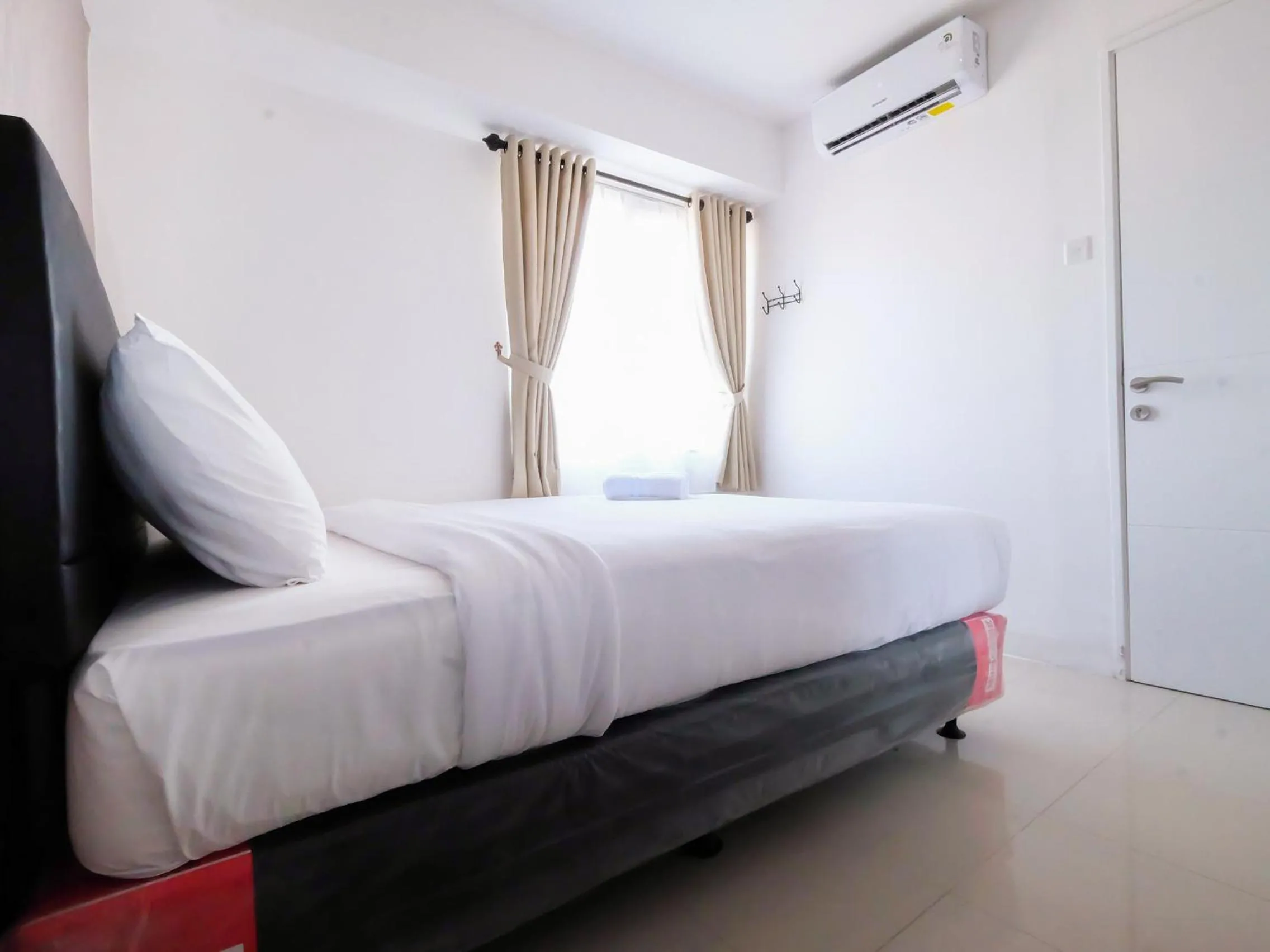 2 BR Bassura City Apartment with Mall Access By Travelio