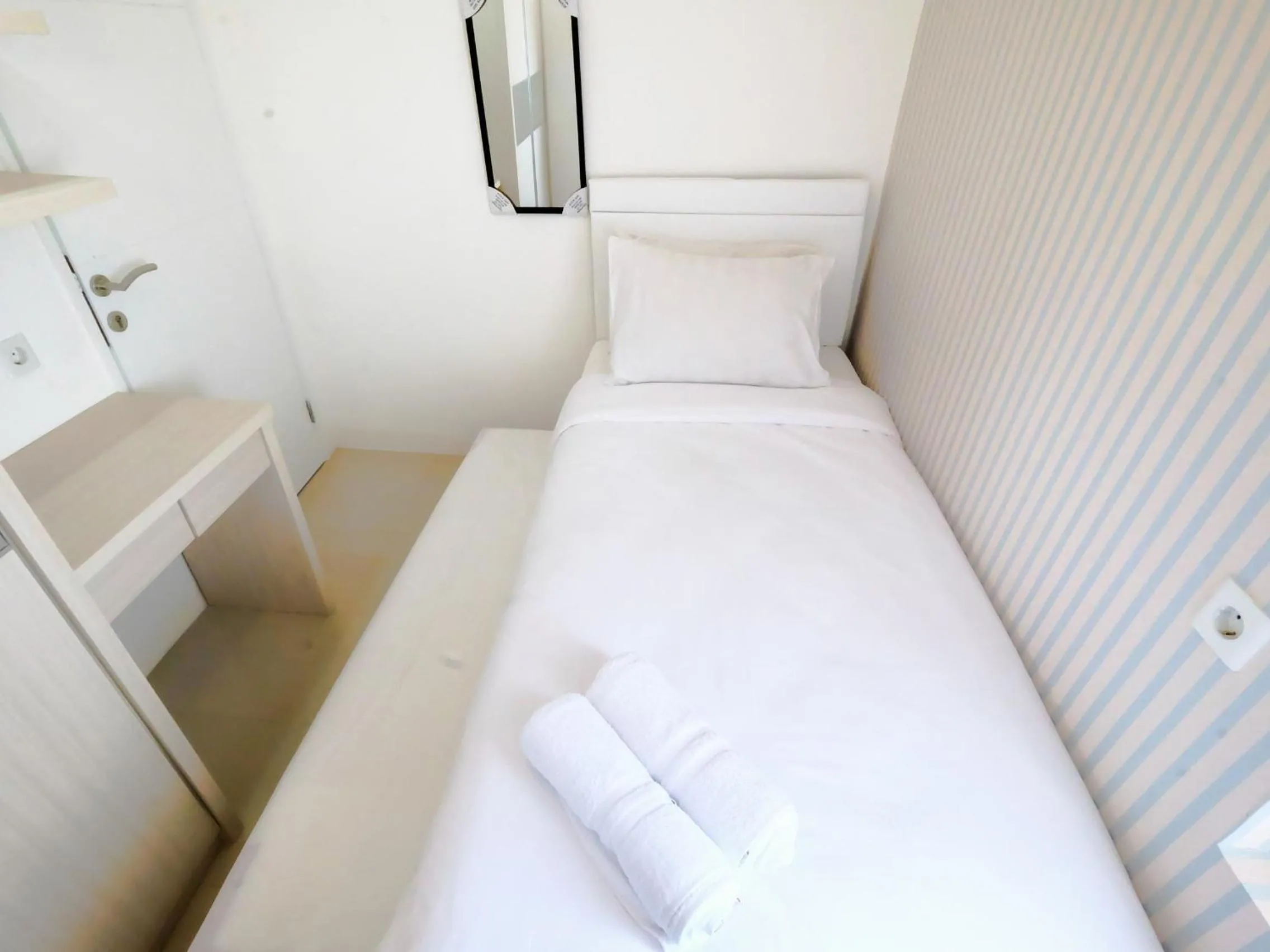 2 BR Bassura City Apartment with Mall Access By Travelio