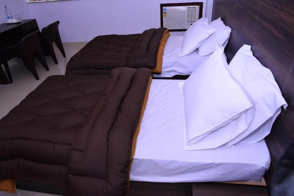 Bed in The Ravindram Hotel