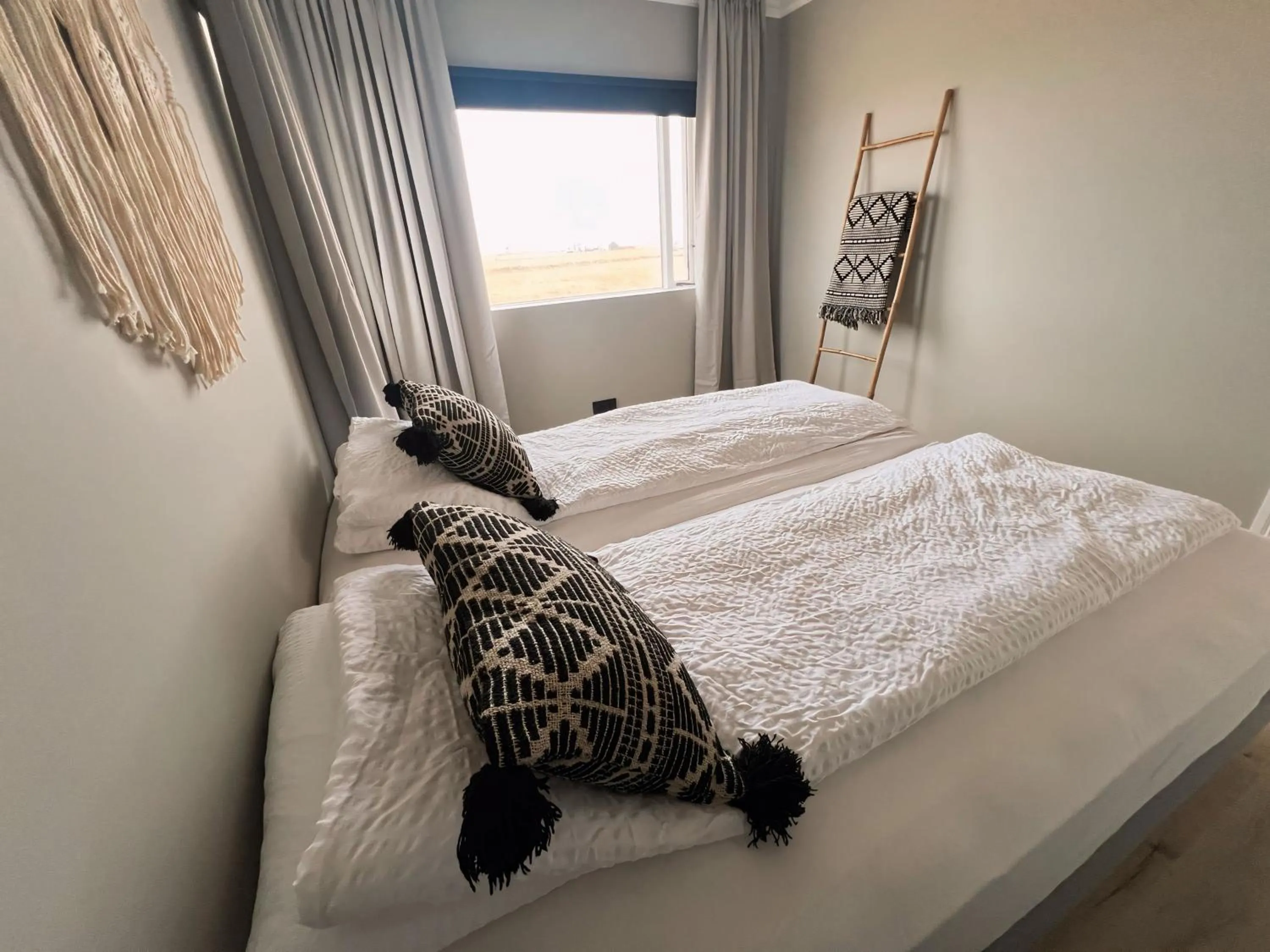 Bed in Garður Apartments