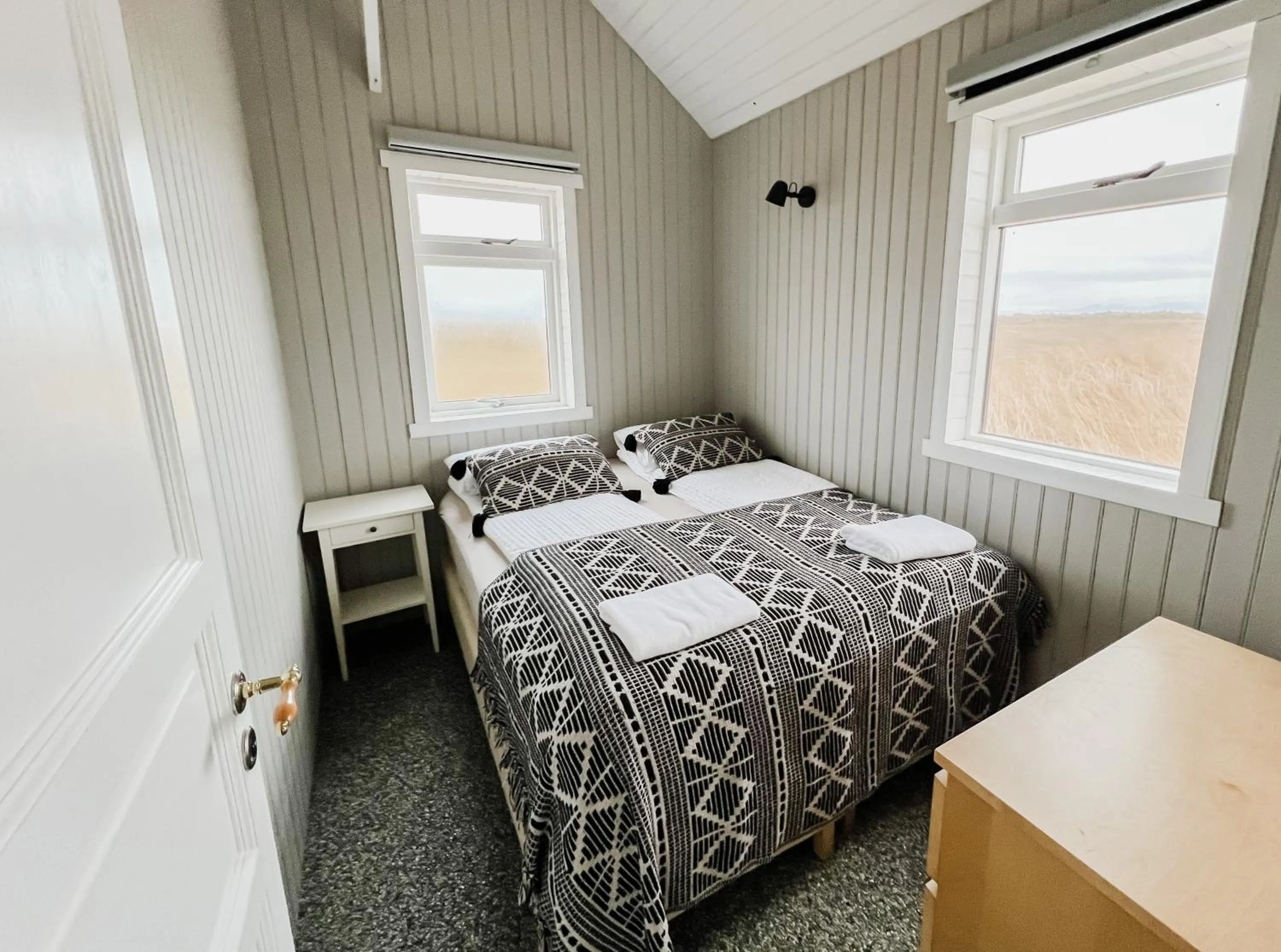 Bed in Garður Apartments