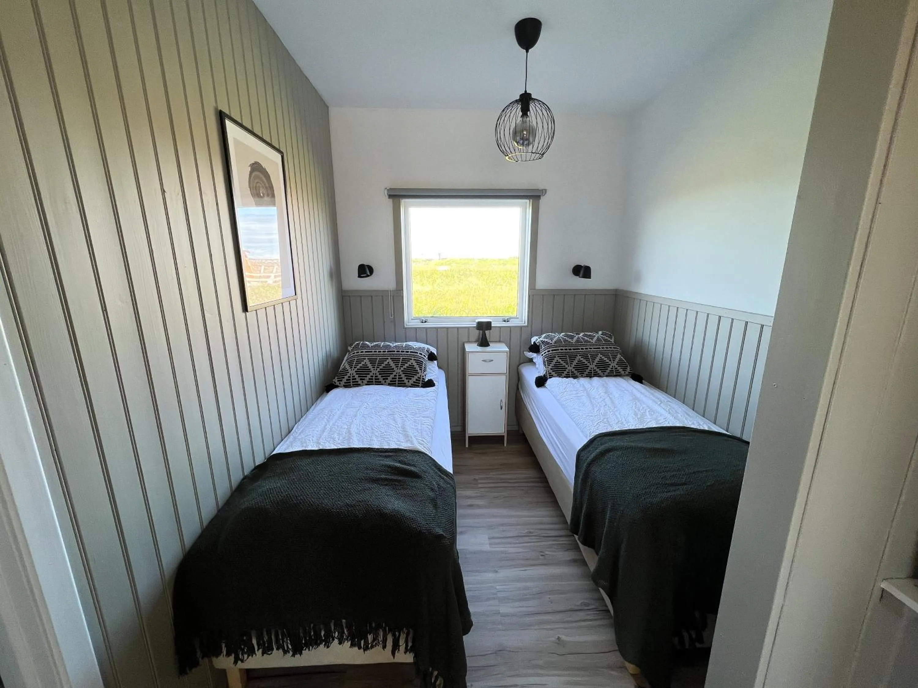 Bed in Garður Apartments
