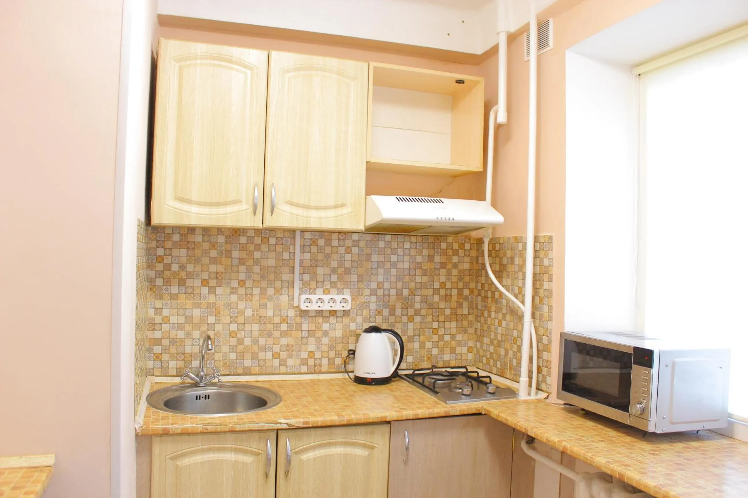 Kitchen or kitchenette in Uneed Rooms Harbour