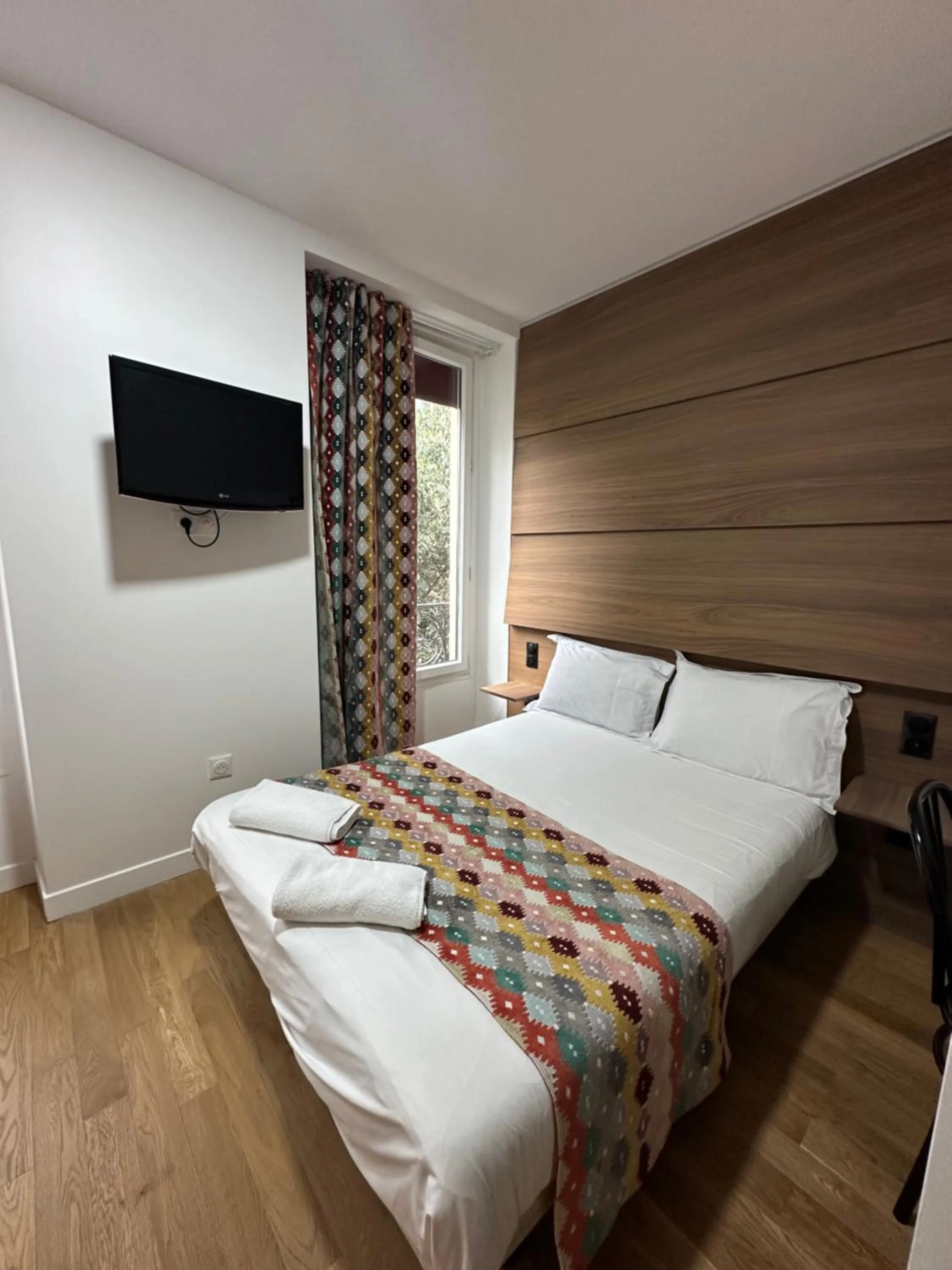 Bed in Hotel Paris Bruxelles