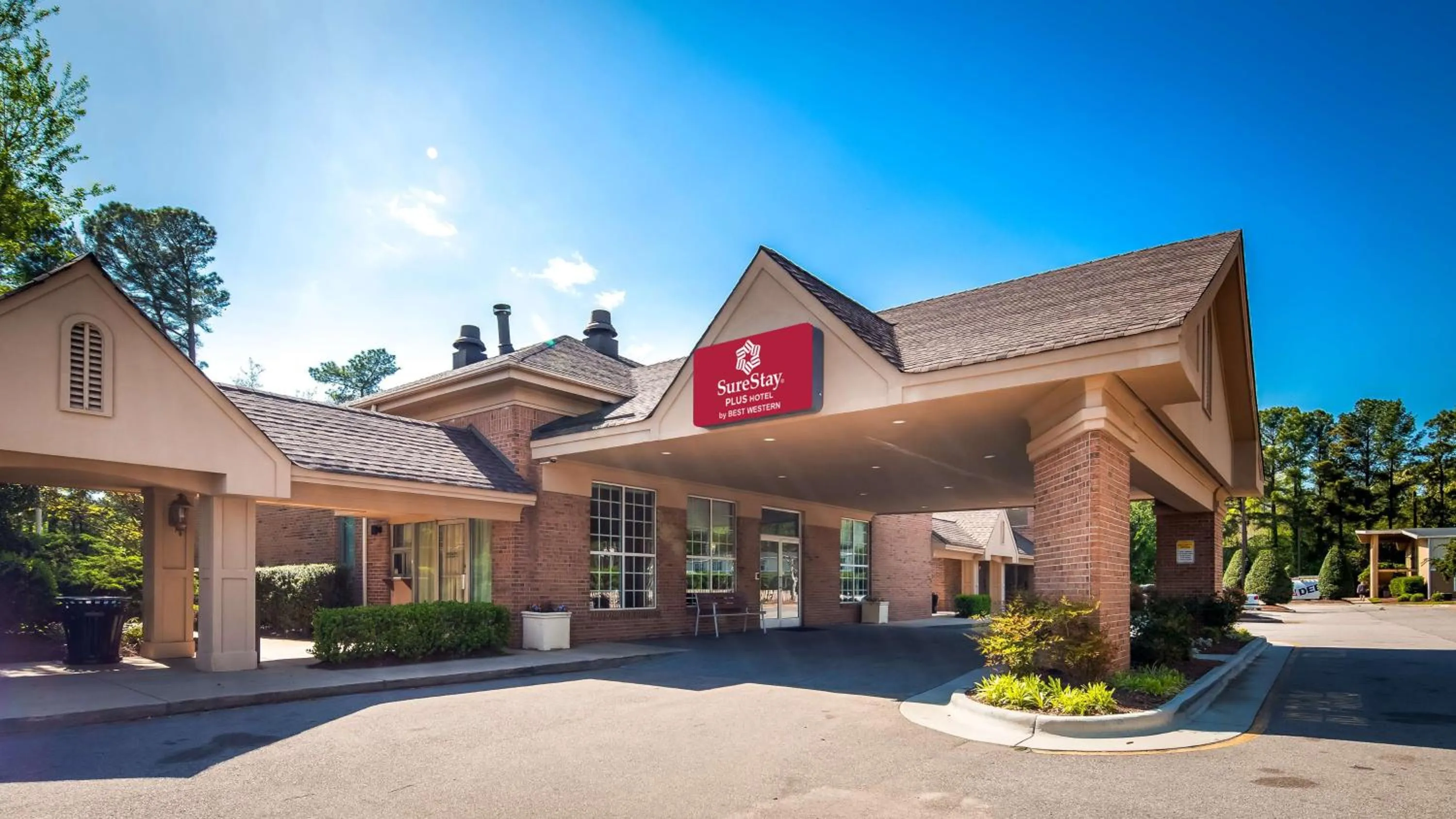 Property Building in SureStay Plus Hotel by Best Western Raleigh North Downtown