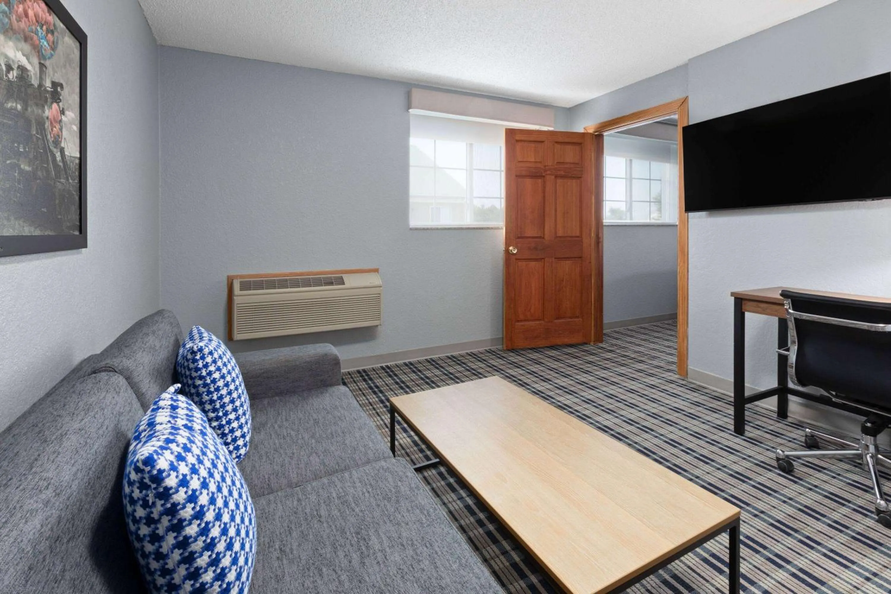 Living room in AmericInn by Wyndham Grinnell
