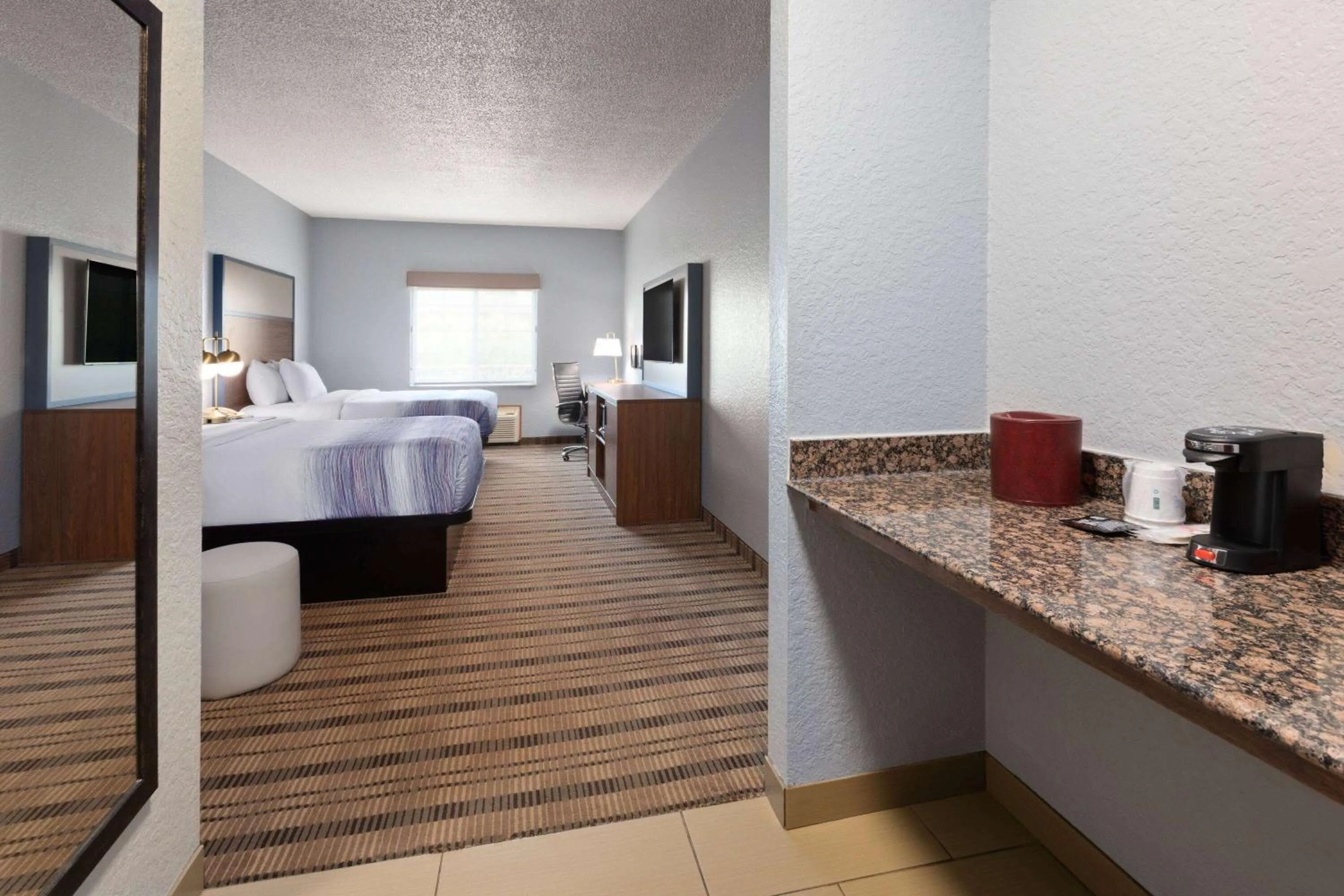 Photo of the whole room, Bed in AmericInn by Wyndham Grinnell