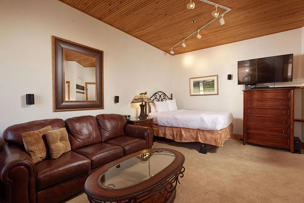 Photo of the whole room, Bed in Independence Square Unit 306, Hotel Room with Large Sitting Area & Wet Bar