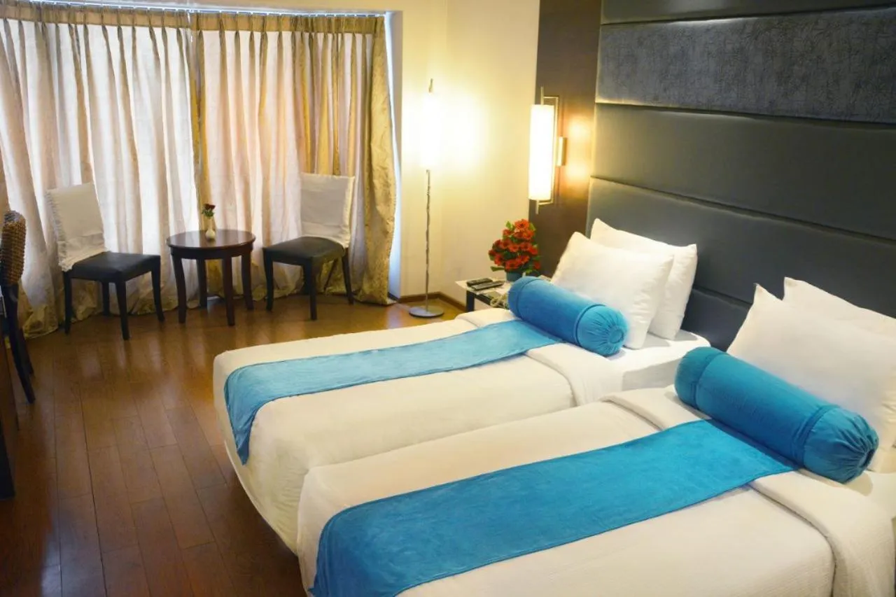 Bed in Ashraya International Hotel