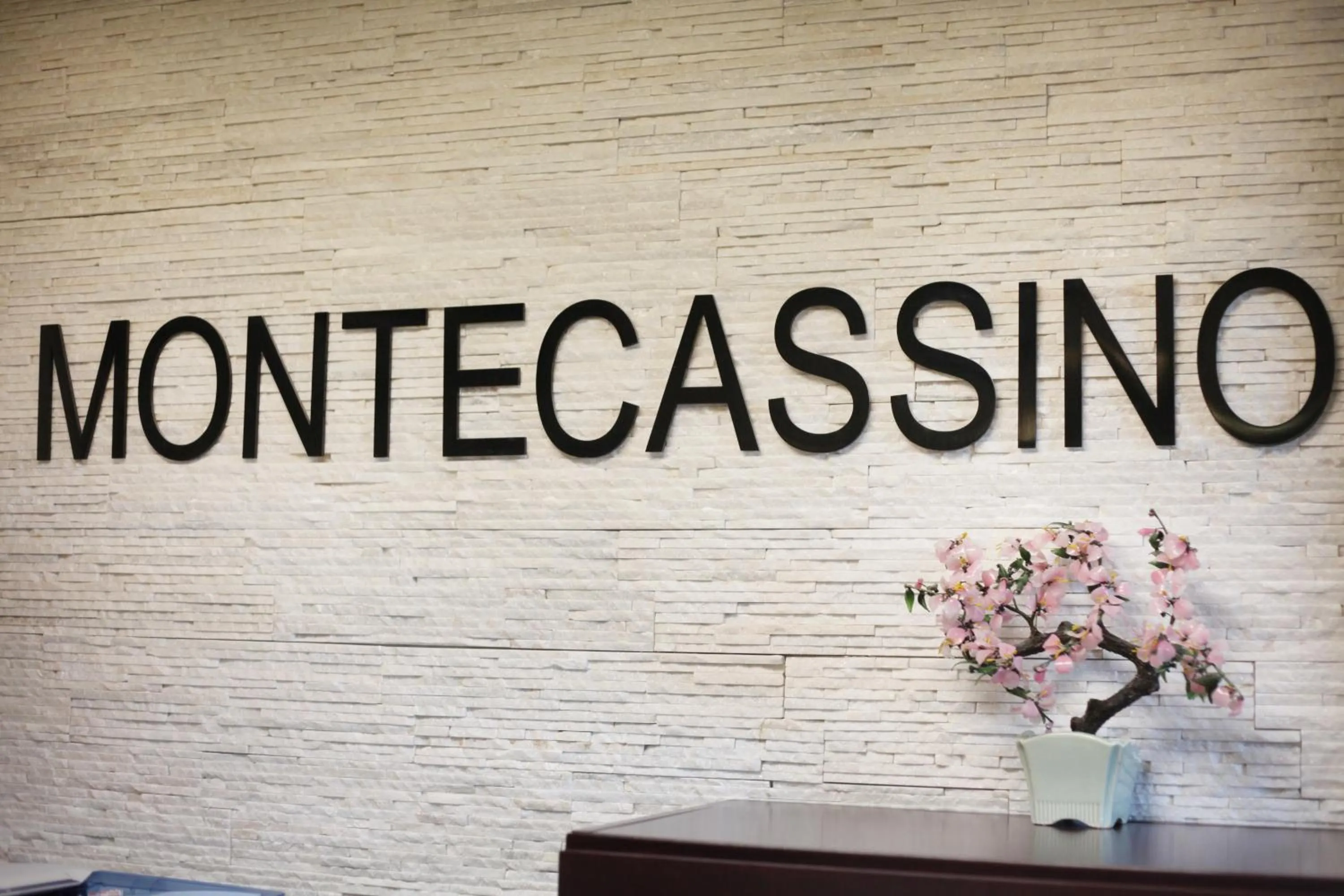 Property logo or sign in Montecassino Hotel & Event Centre