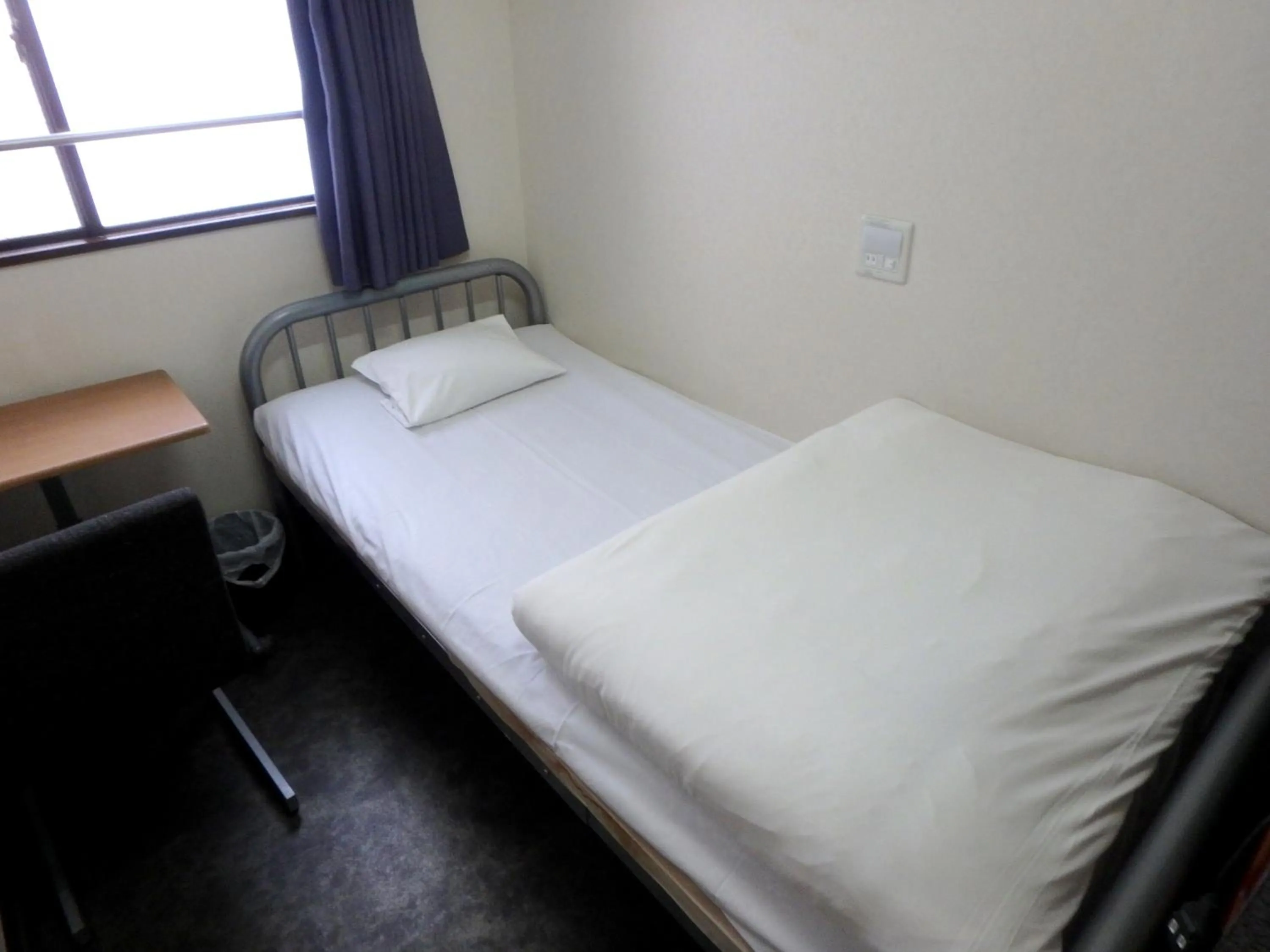 Bed in Economy Hotel Hoteiya